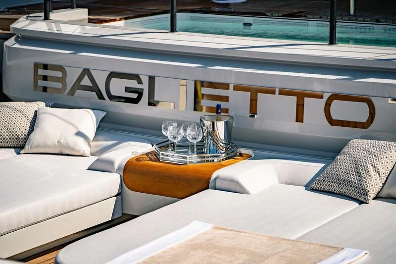a room with a bed and a glass of water aboard INFINITY Yacht for Sale