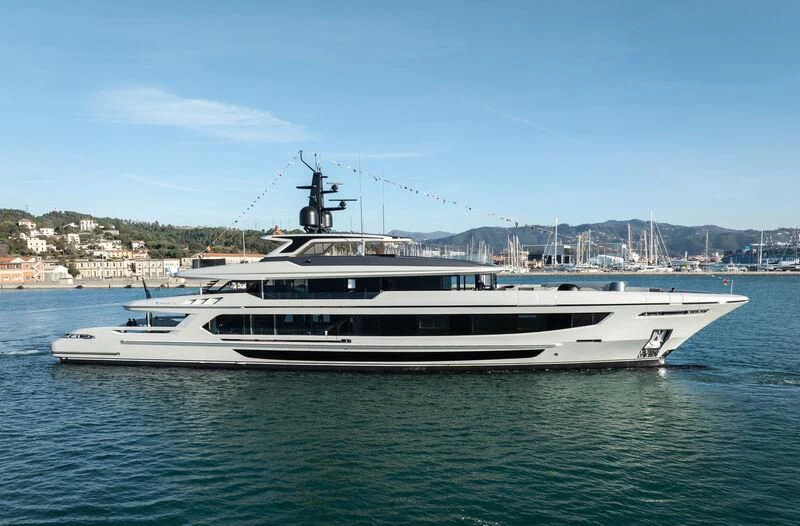a white boat in the water aboard INFINITY Yacht for Sale