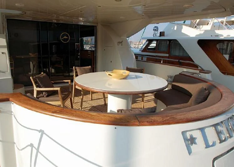 a table with chairs around it aboard LEIGH Yacht for Sale