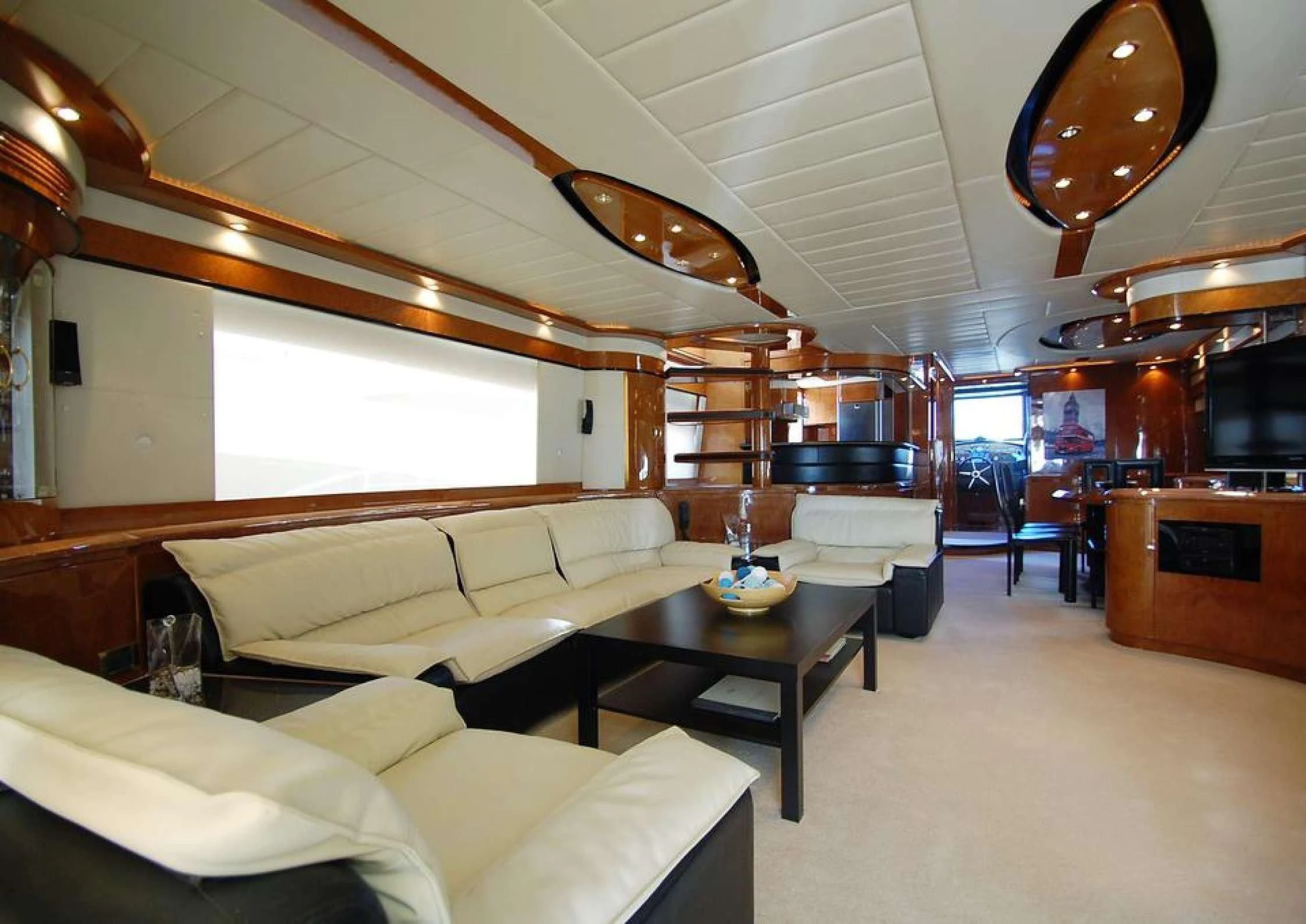 a living room with a couch and a table aboard LEIGH Yacht for Sale