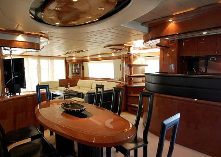 a dining room with a table and chairs aboard LEIGH Yacht for Sale