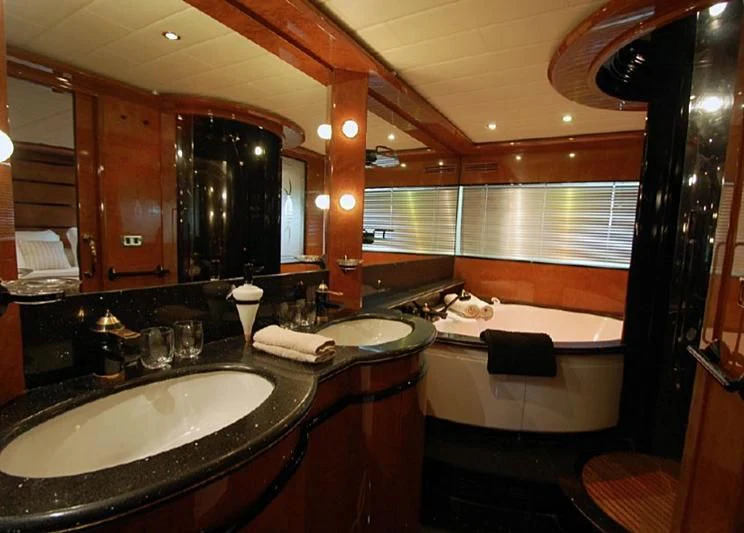 a bathroom with a large mirror aboard LEIGH Yacht for Sale