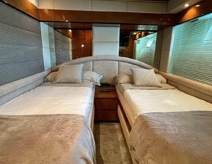 a room with beds and a window aboard LEIGH Yacht for Sale