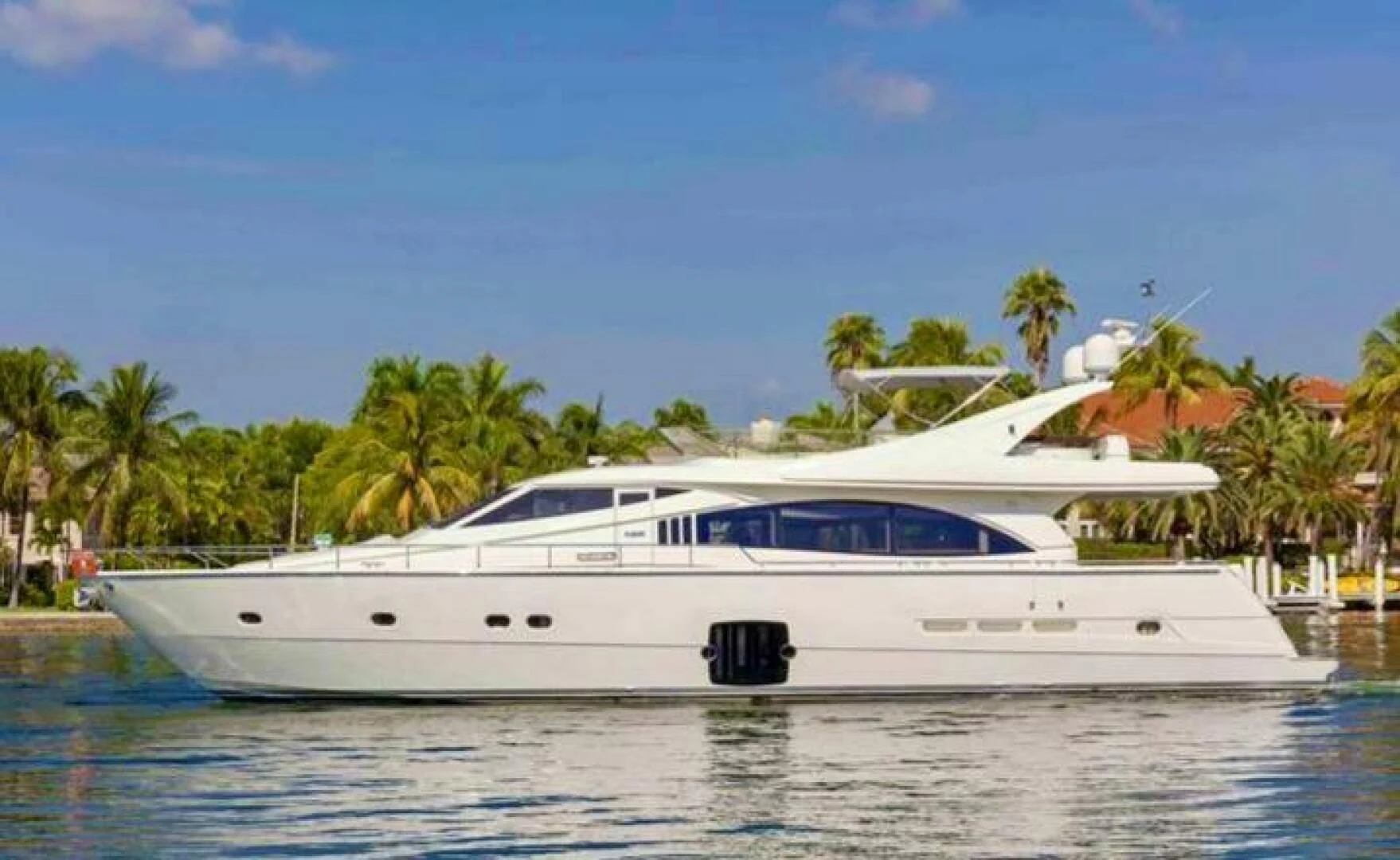 a white yacht on the water aboard SEDROP Yacht for Sale