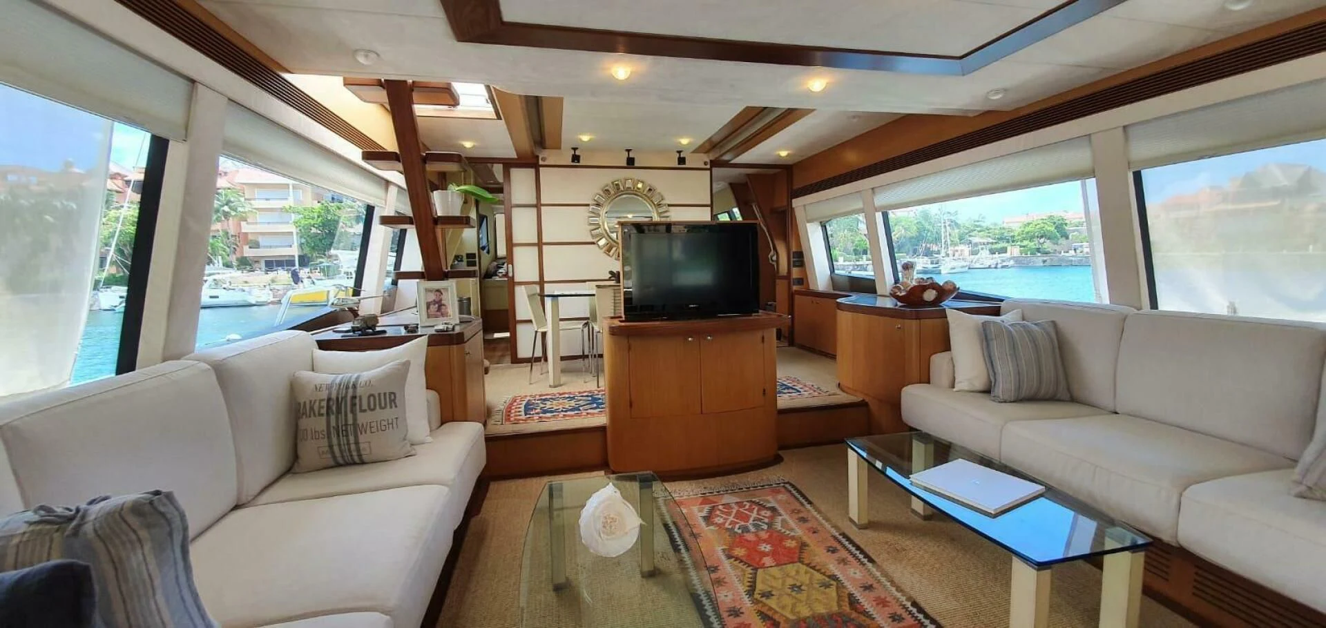 a living room with a large window aboard SEDROP Yacht for Sale