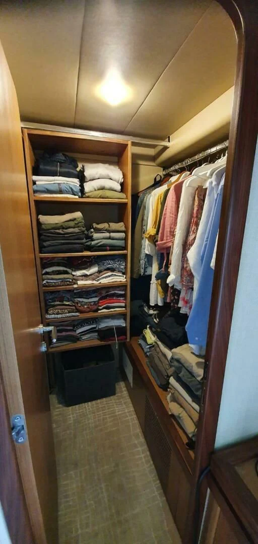 a closet full of clothes aboard SEDROP Yacht for Sale
