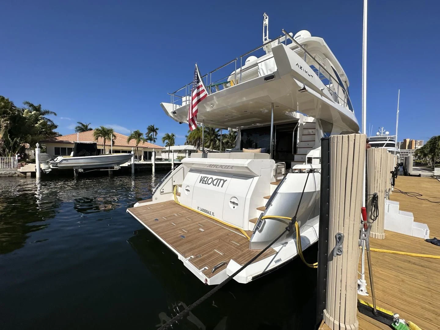 a boat docked at a pier aboard VELOCITY Yacht for Sale
