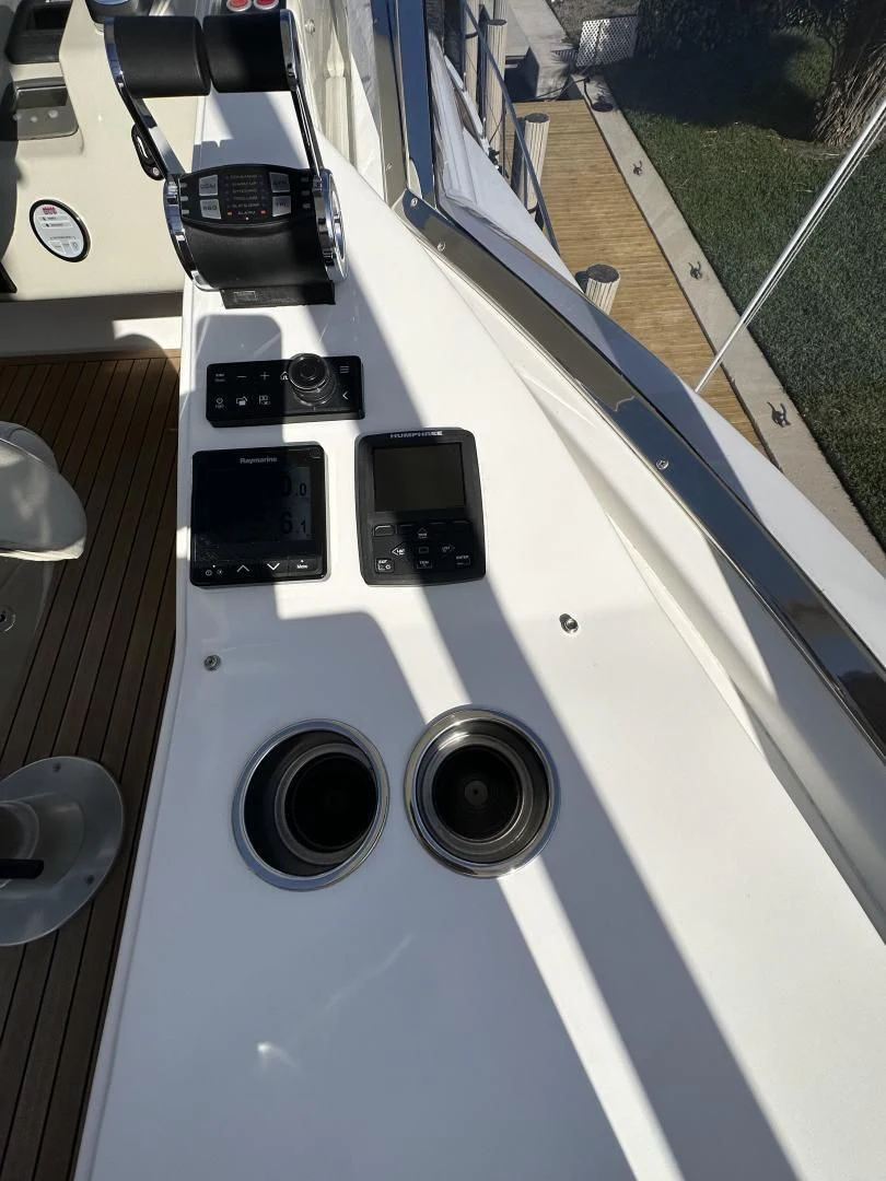 a white car with a black steering wheel aboard VELOCITY Yacht for Sale