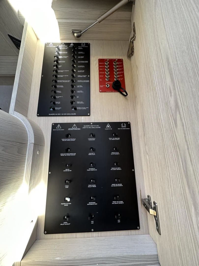 a black rectangular device with a black screen and a red tag on it aboard VELOCITY Yacht for Sale