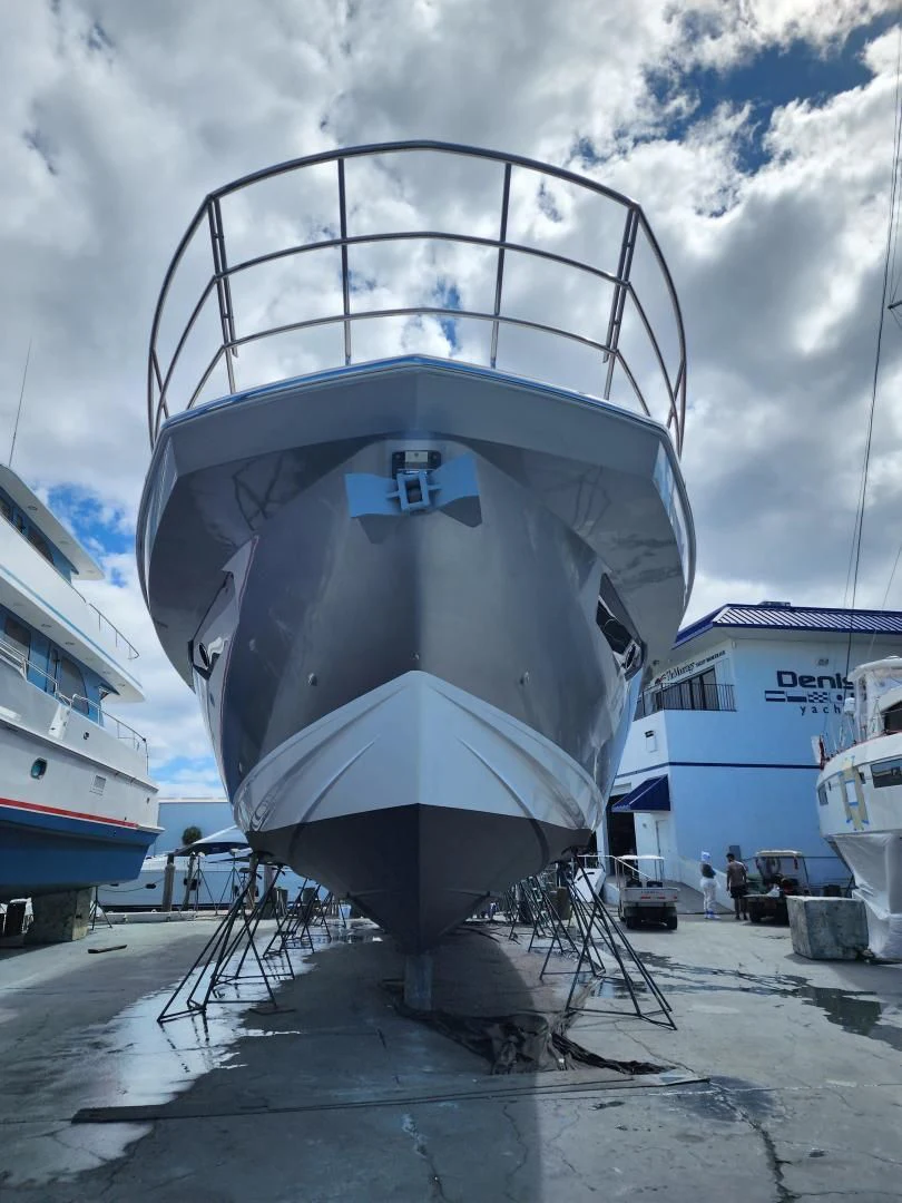 a large white ship docked aboard VELOCITY Yacht for Sale
