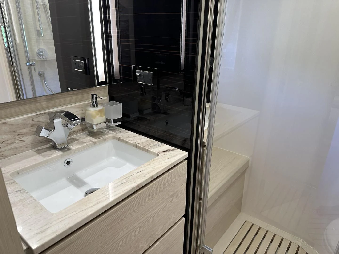 a bathroom with a sink and a mirror aboard VELOCITY Yacht for Sale