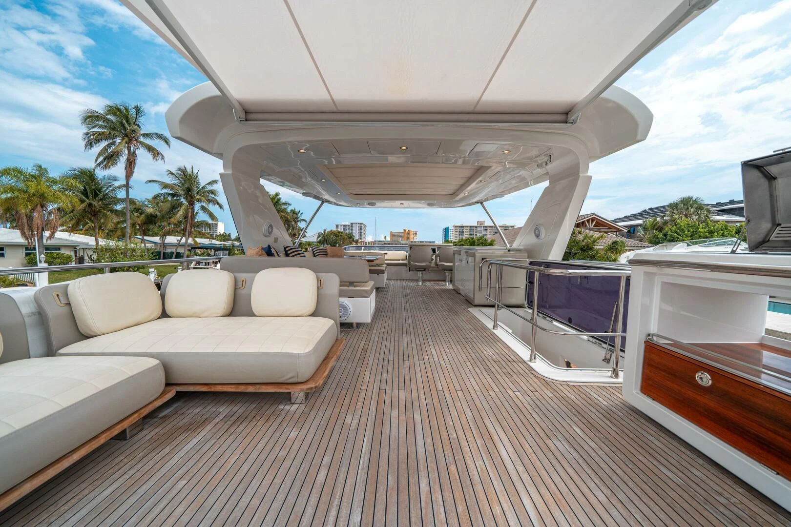 a deck with a couch and a pool aboard VELOCITY Yacht for Sale