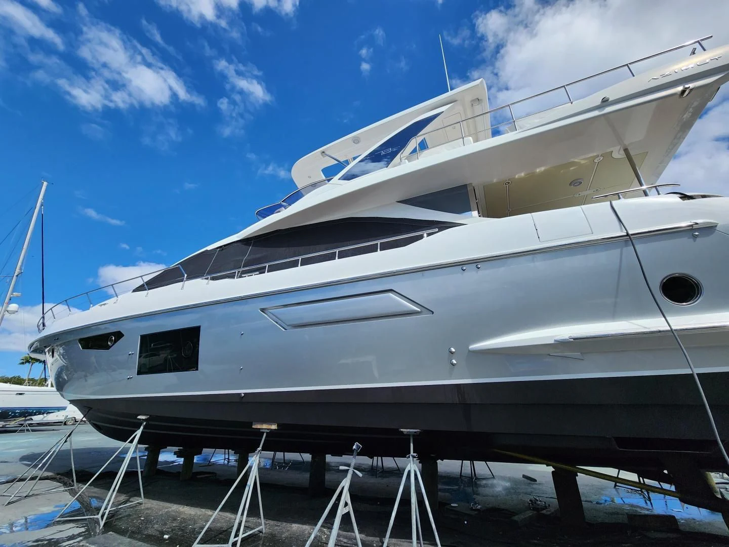 a white boat on a trailer aboard VELOCITY Yacht for Sale