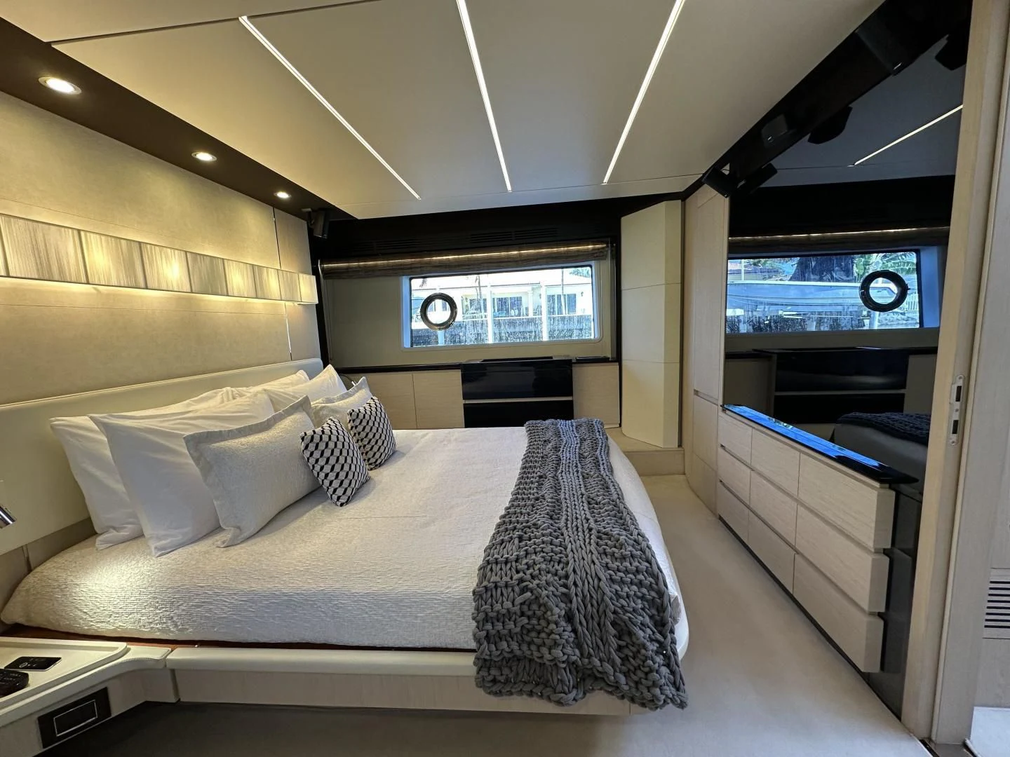 a room with a bed and a window aboard VELOCITY Yacht for Sale