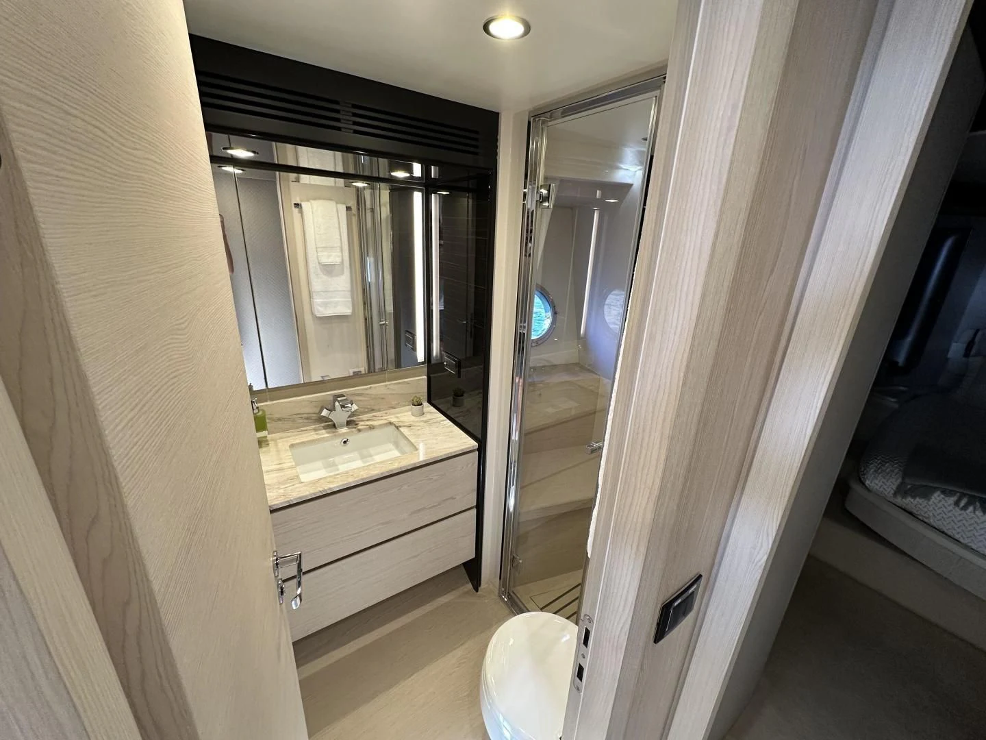 a bathroom with a large mirror aboard VELOCITY Yacht for Sale