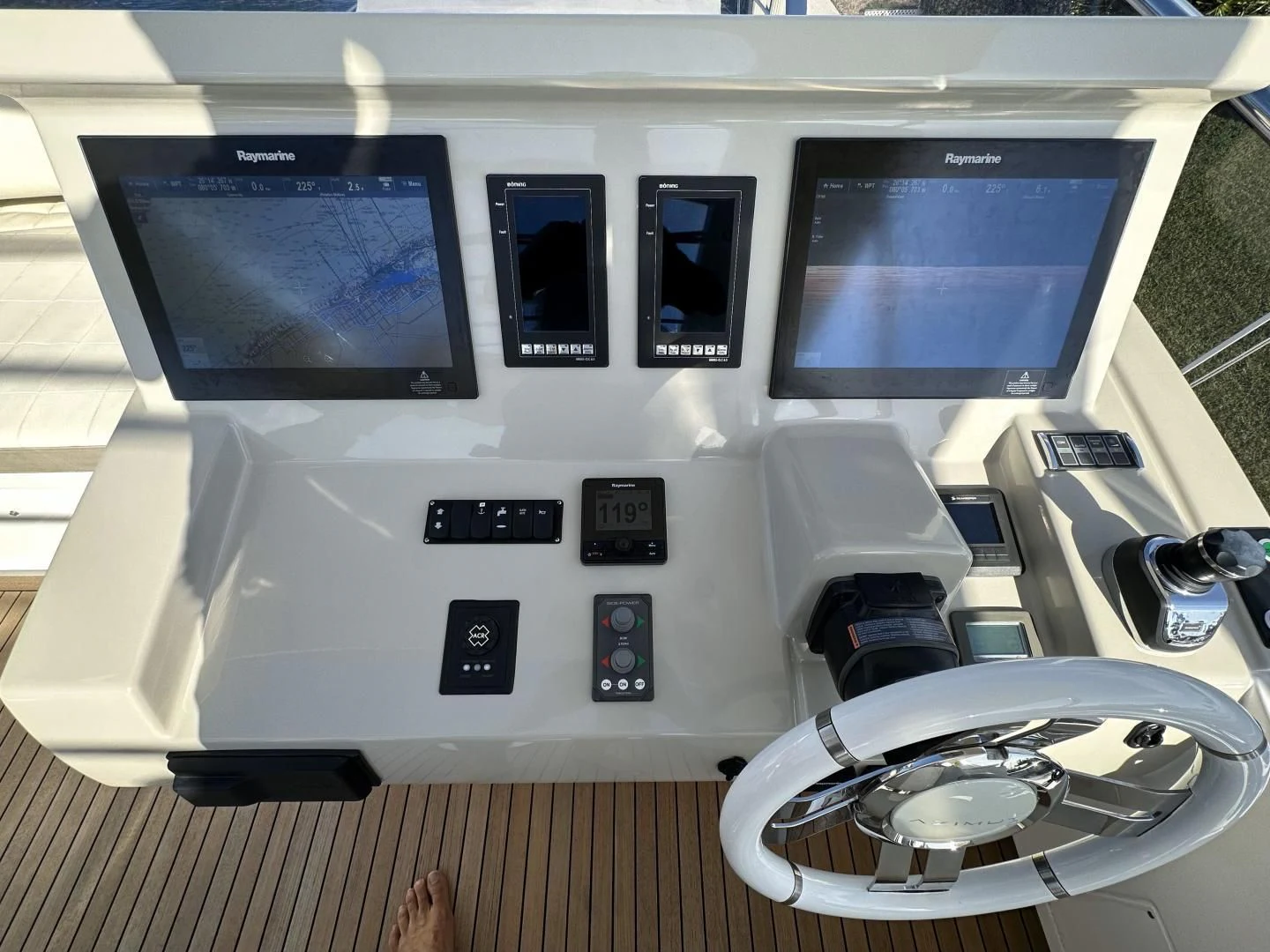 a white electronic device with a screen aboard VELOCITY Yacht for Sale