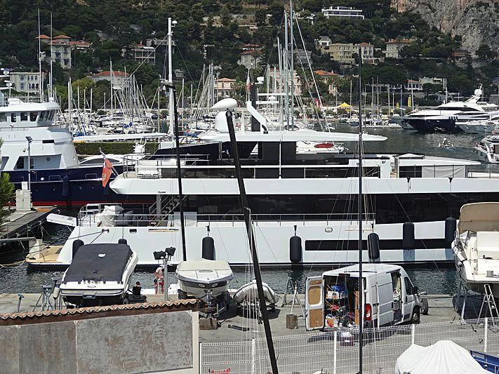 a group of boats are parked in a harbor aboard QUINTET Yacht for Sale