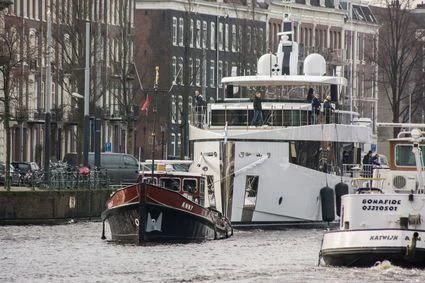a boat is parked next to a boat aboard QUINTET Yacht for Sale