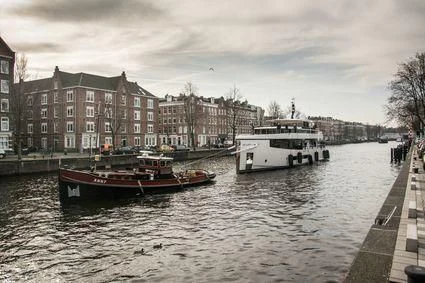 a boat is moving through a canal aboard QUINTET Yacht for Sale