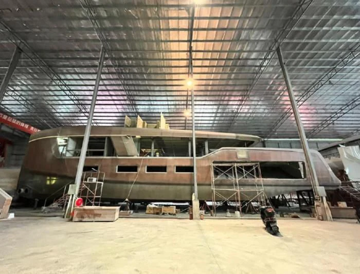 a large warehouse with a large metal structure aboard AZURE III Yacht for Sale