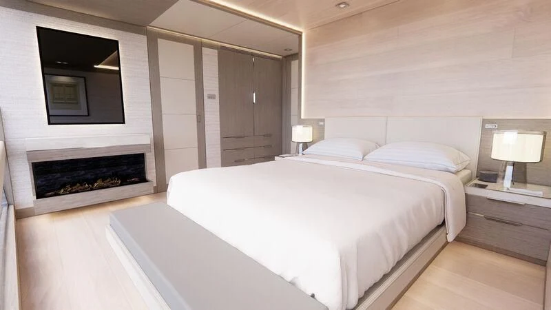 a large bedroom with a bed and a fireplace aboard AZURE III Yacht for Sale