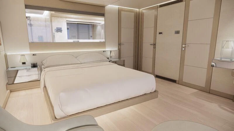 a room with a bed and a closet aboard AZURE III Yacht for Sale