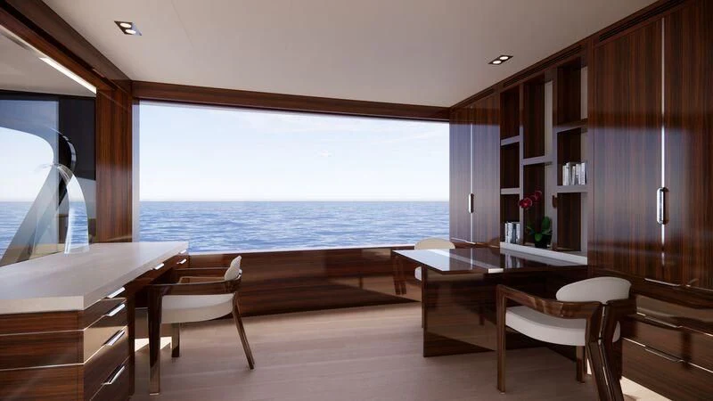 a room with a table chairs and a large body of water aboard AZURE III Yacht for Sale
