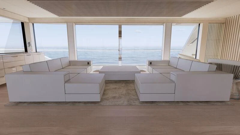 a room with a group of couches aboard AZURE III Yacht for Sale