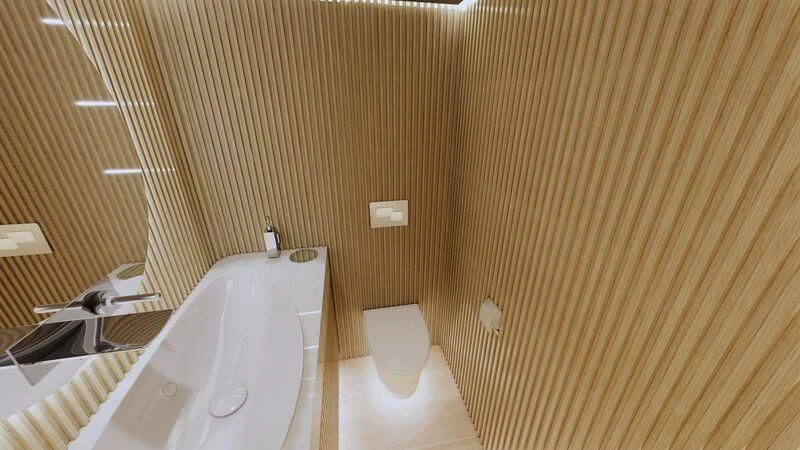 a bathroom with a tub and toilet aboard AZURE III Yacht for Sale