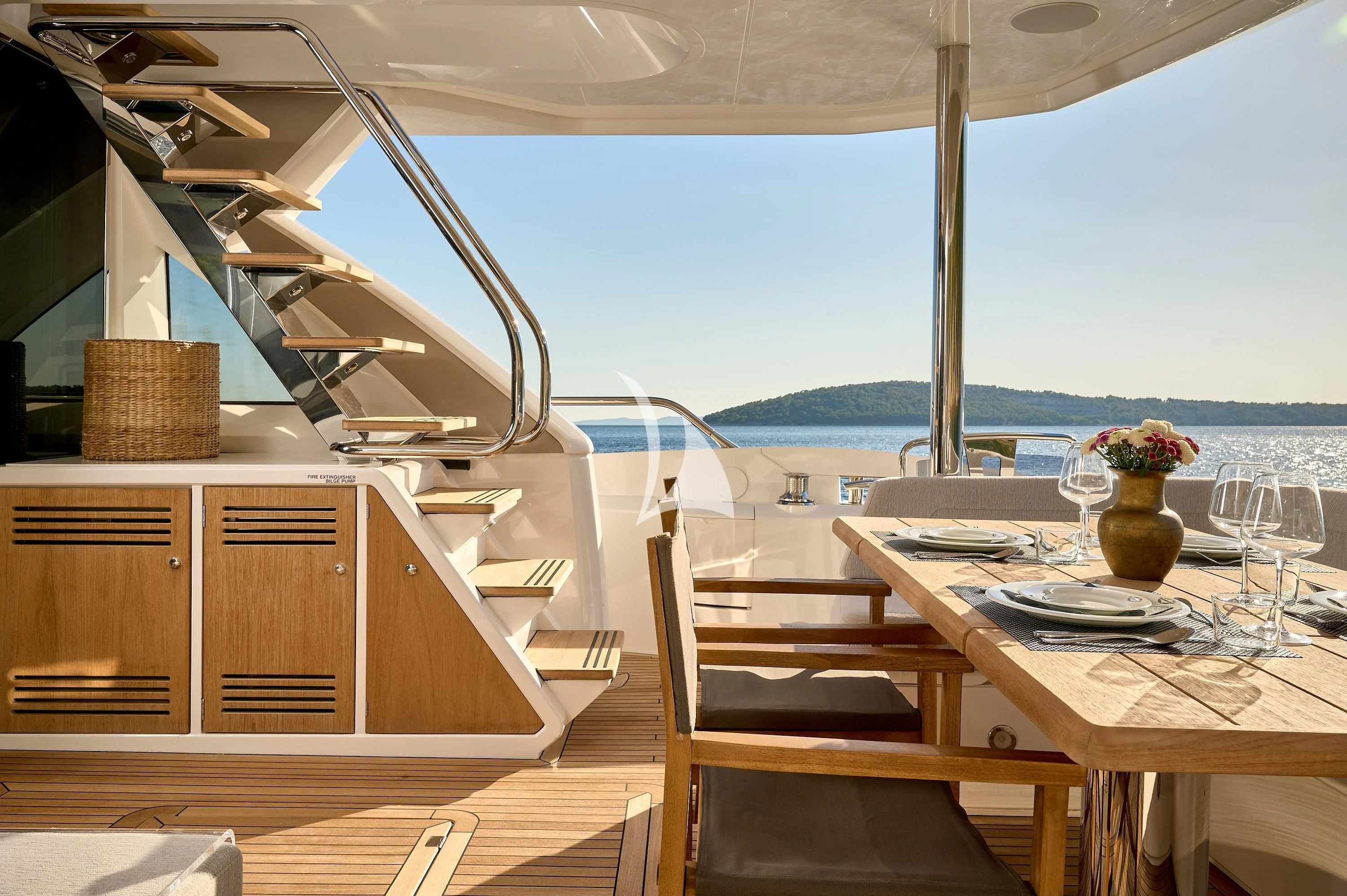 a table and chairs on a patio aboard HIDEAWAY Yacht for Charter