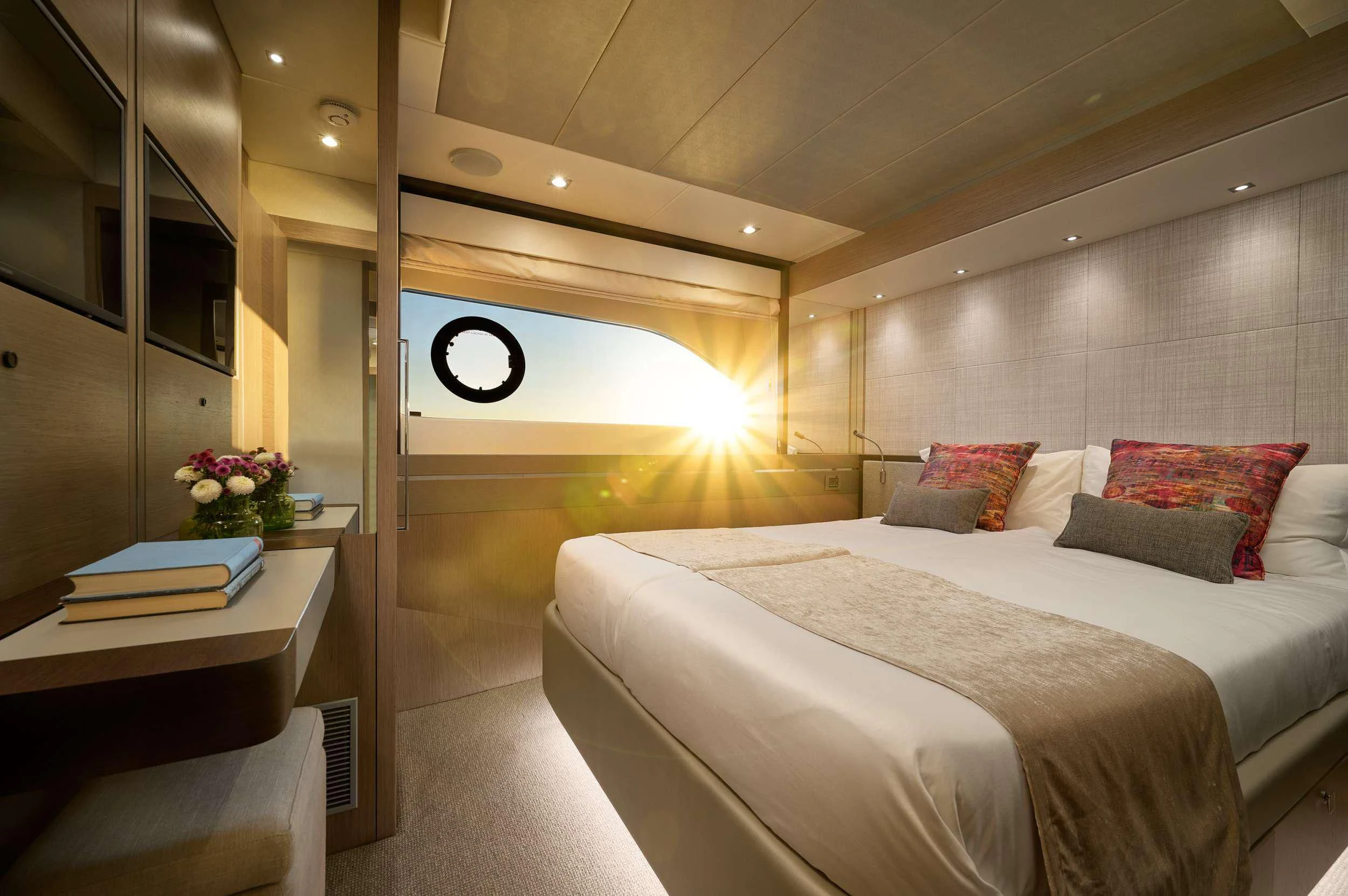 a room with a bed and a desk aboard HIDEAWAY Yacht for Charter
