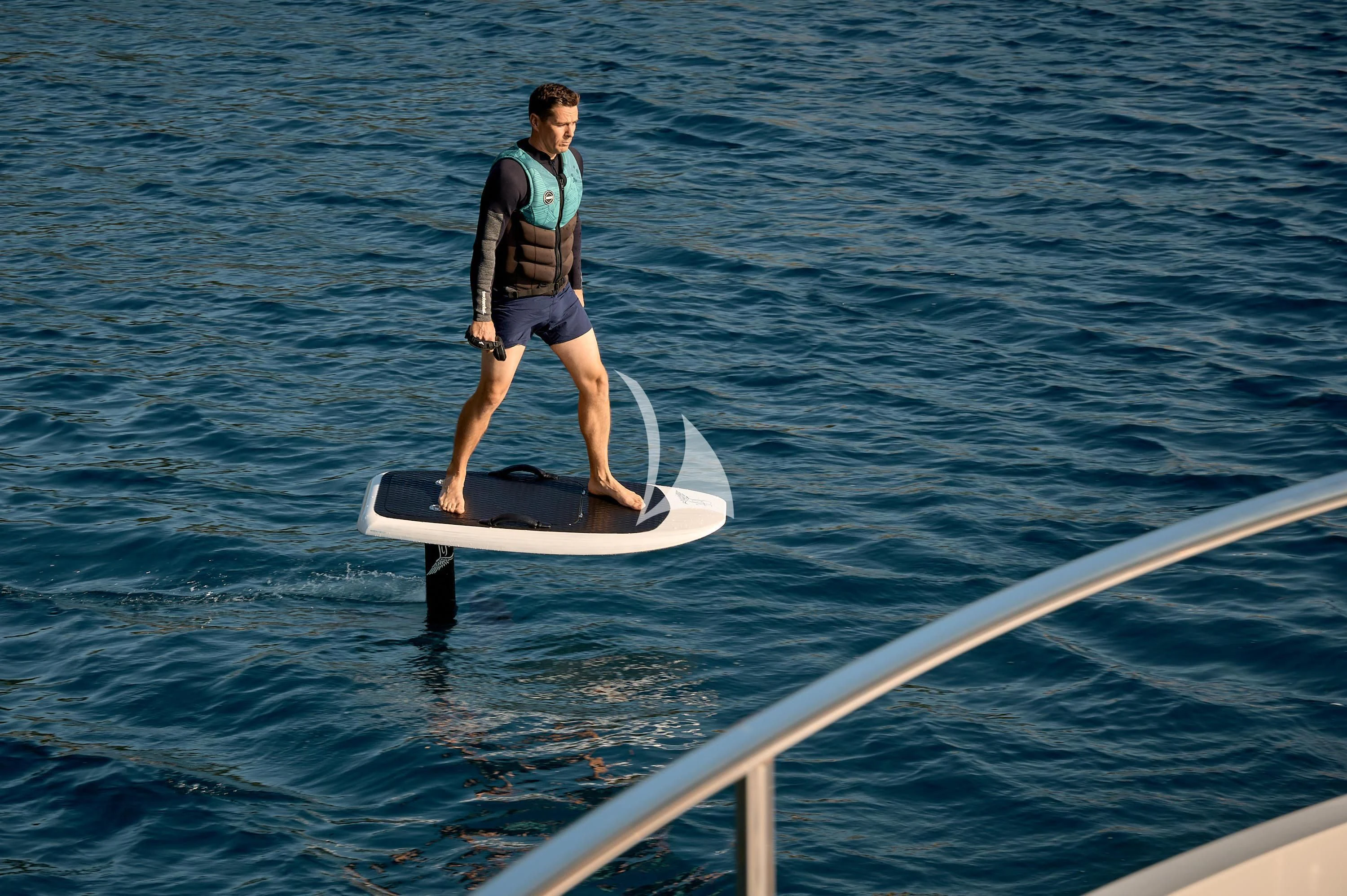 a person on a surfboard aboard HIDEAWAY Yacht for Charter
