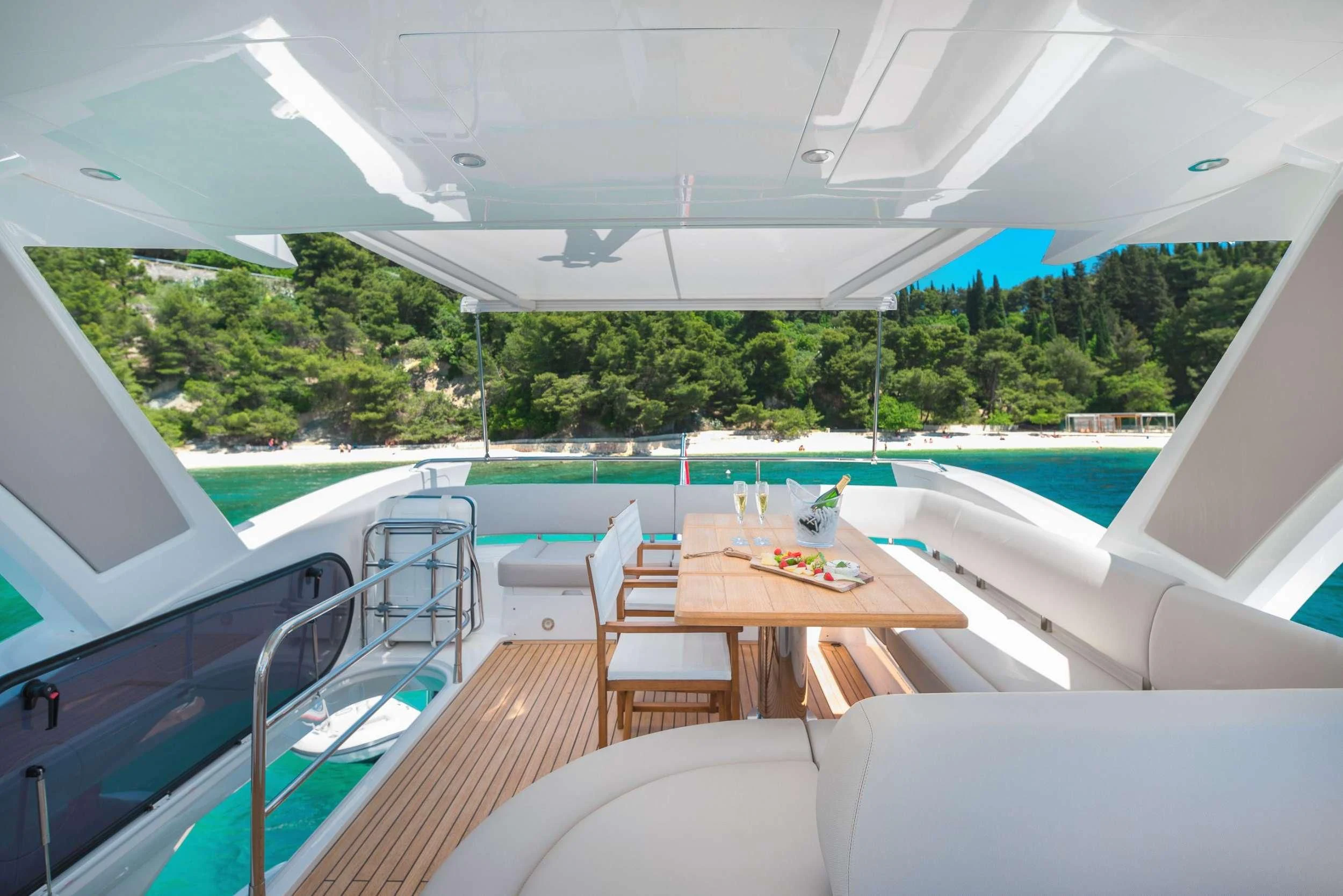 a pool with a table and chairs aboard HIDEAWAY Yacht for Charter
