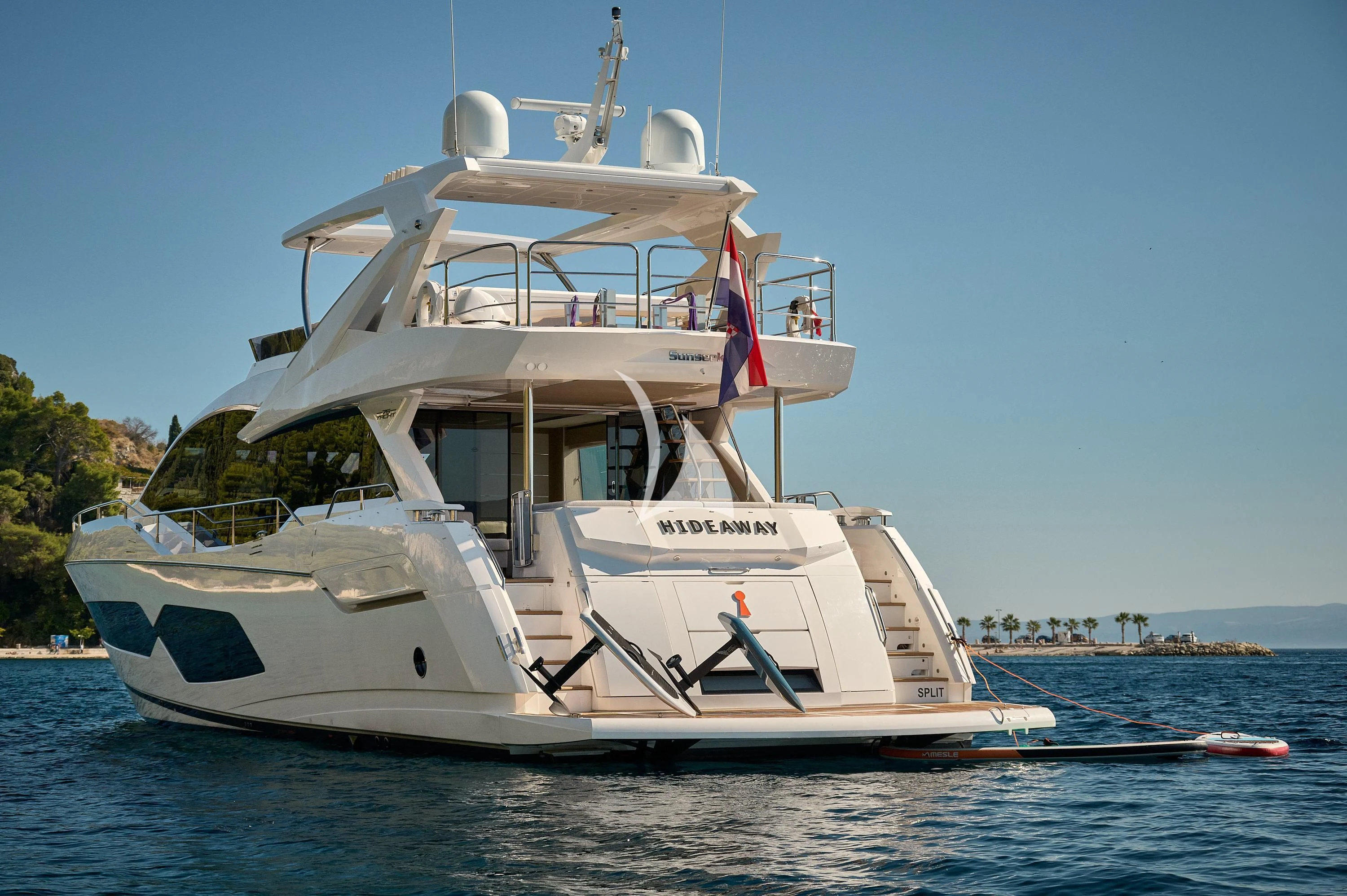 a white boat on the water aboard HIDEAWAY Yacht for Charter