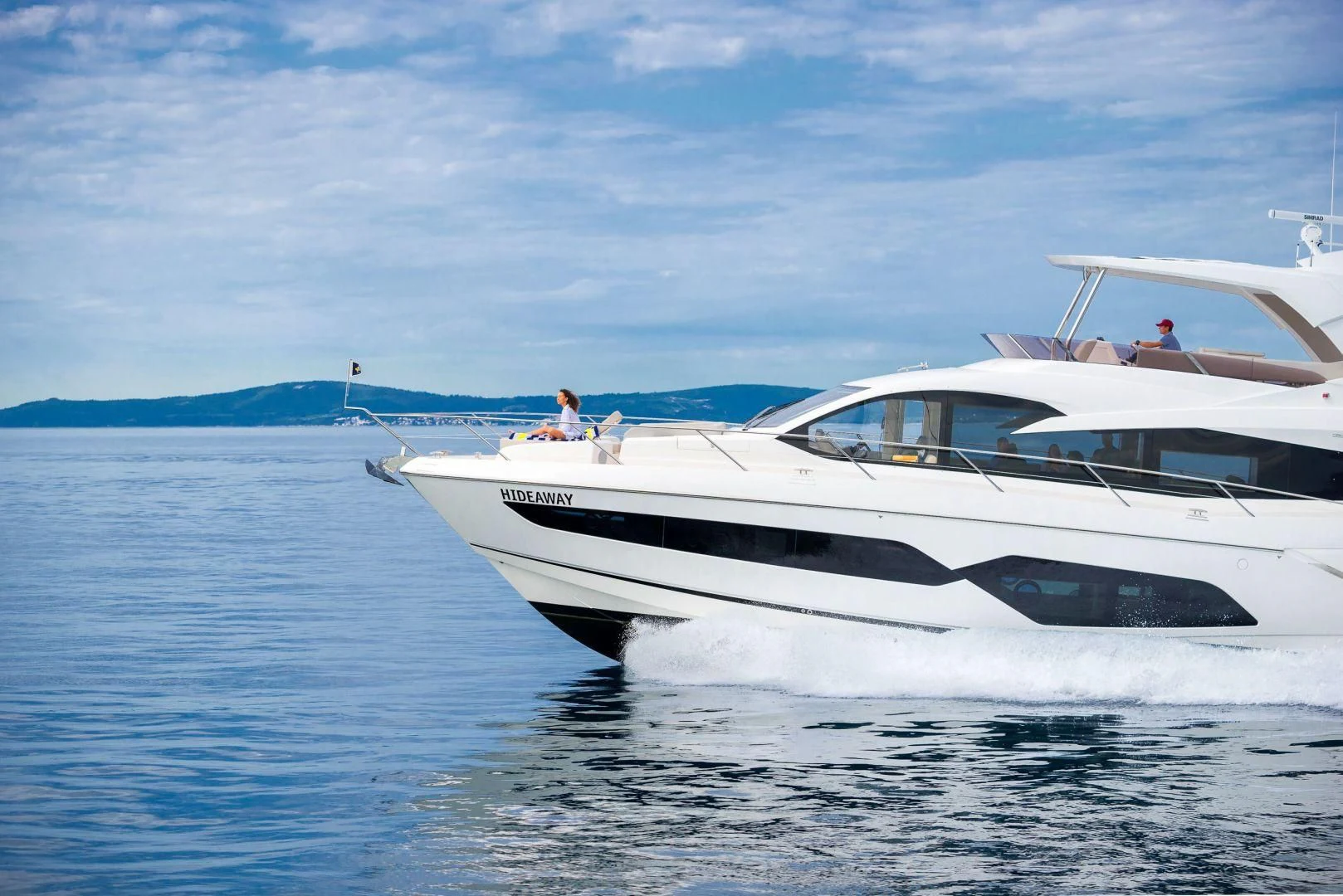 a white boat in the water aboard HIDEAWAY Yacht for Charter