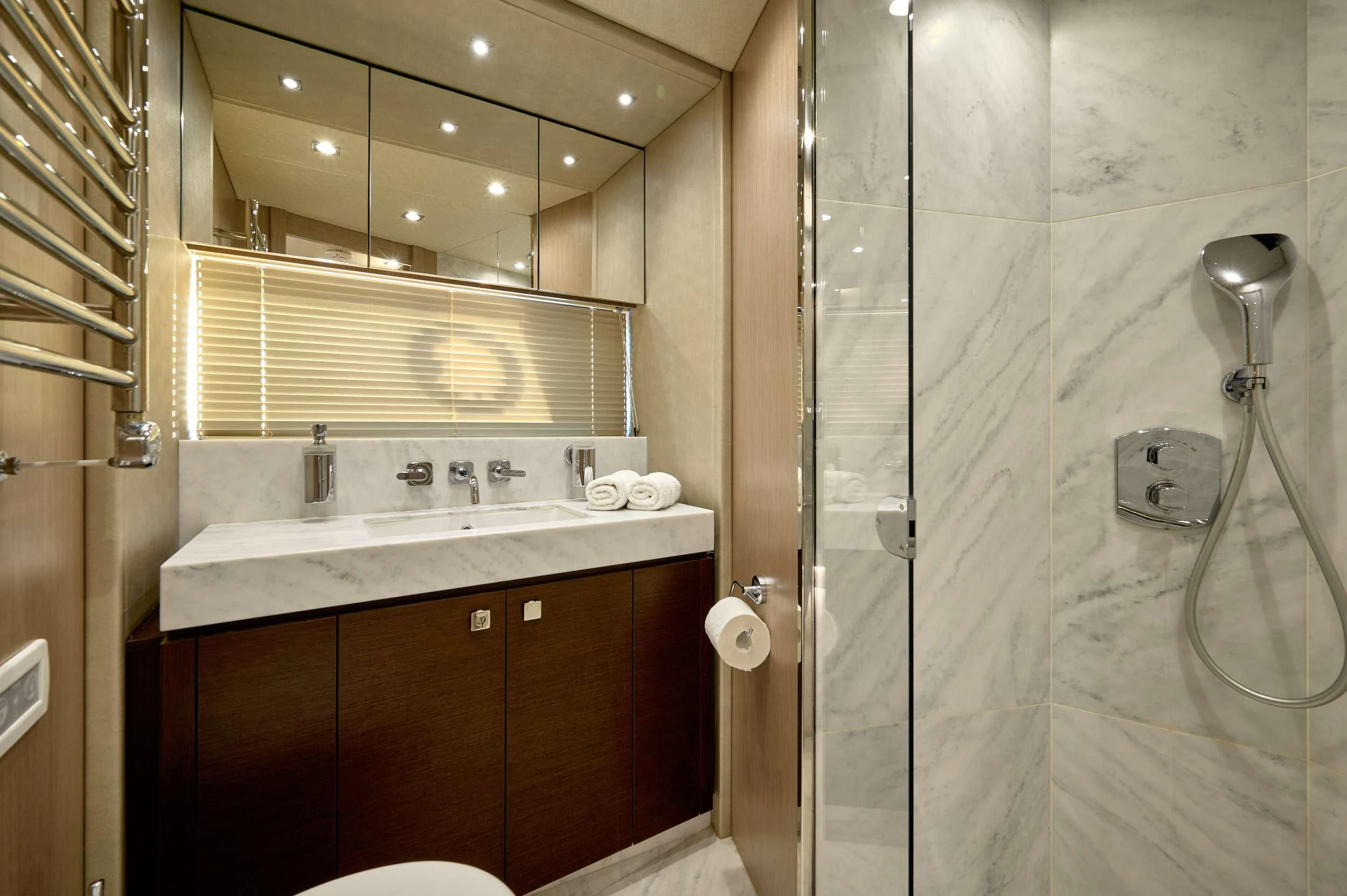 a bathroom with a shower unit and sink aboard HIDEAWAY Yacht for Charter