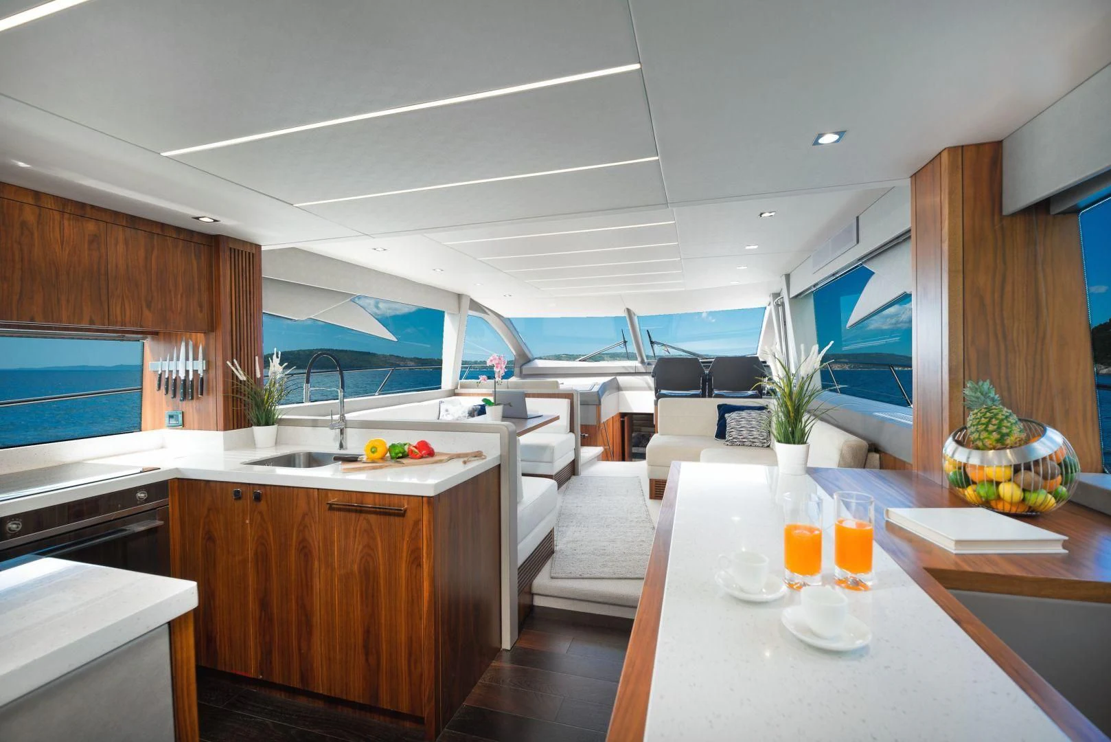 a modern kitchen with a large window aboard HIDEAWAY Yacht for Charter