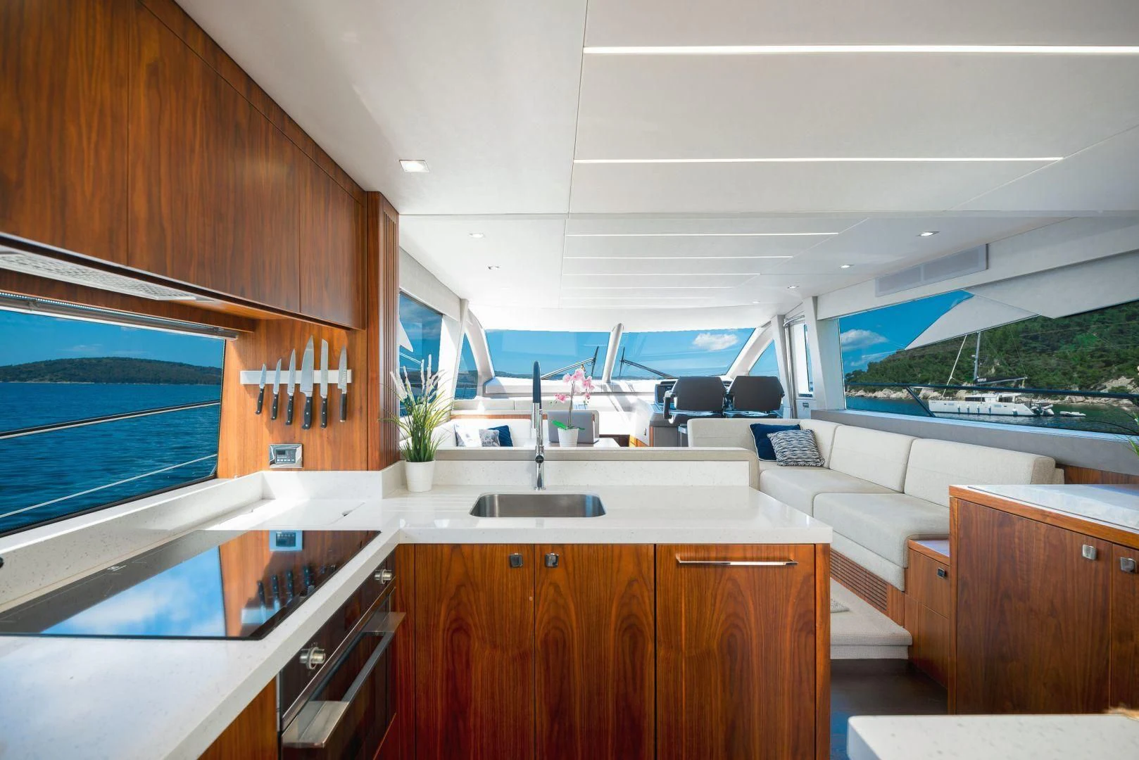 a kitchen with a sink and a couch aboard HIDEAWAY Yacht for Charter