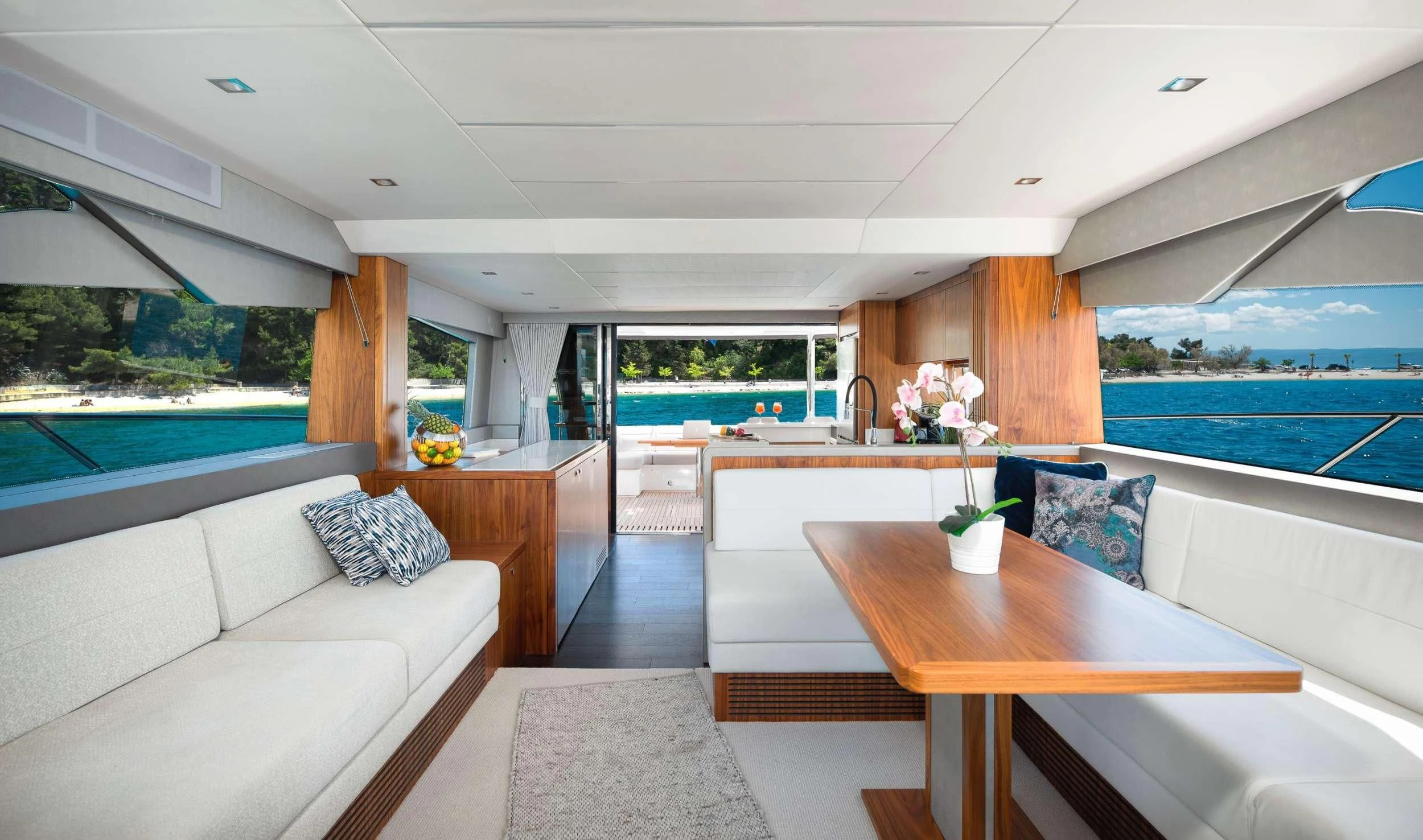a living room with a large window aboard HIDEAWAY Yacht for Charter