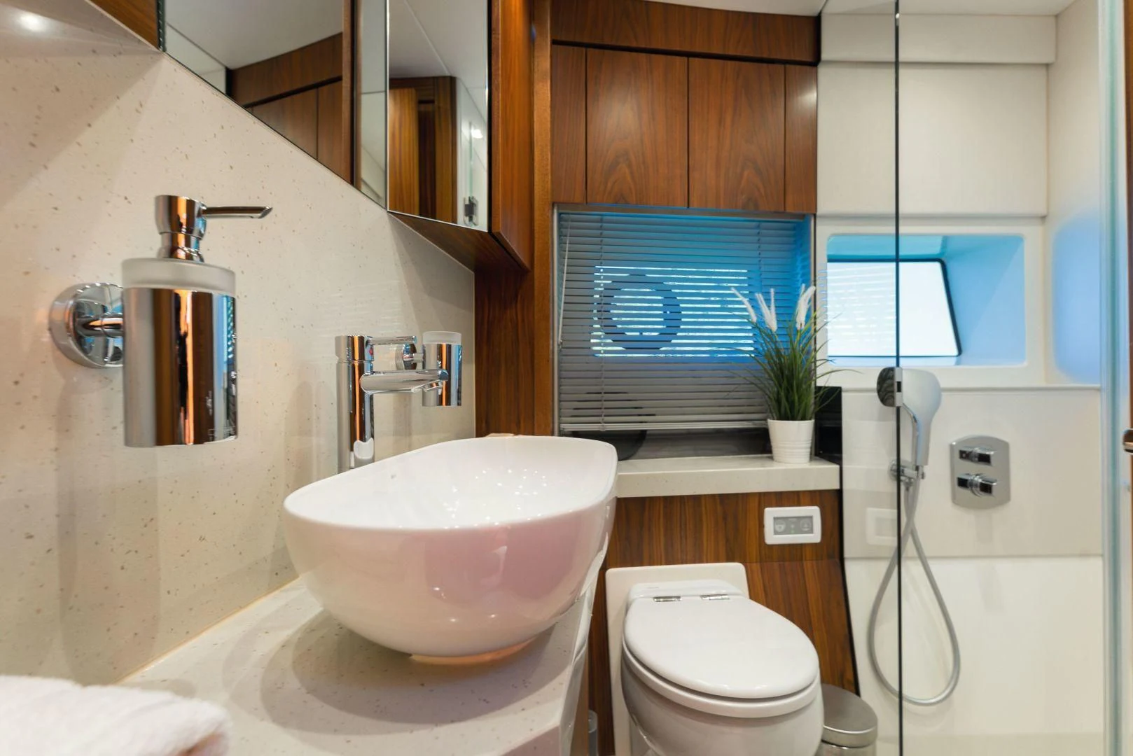 a bathroom with a sink and a toilet aboard HIDEAWAY Yacht for Charter
