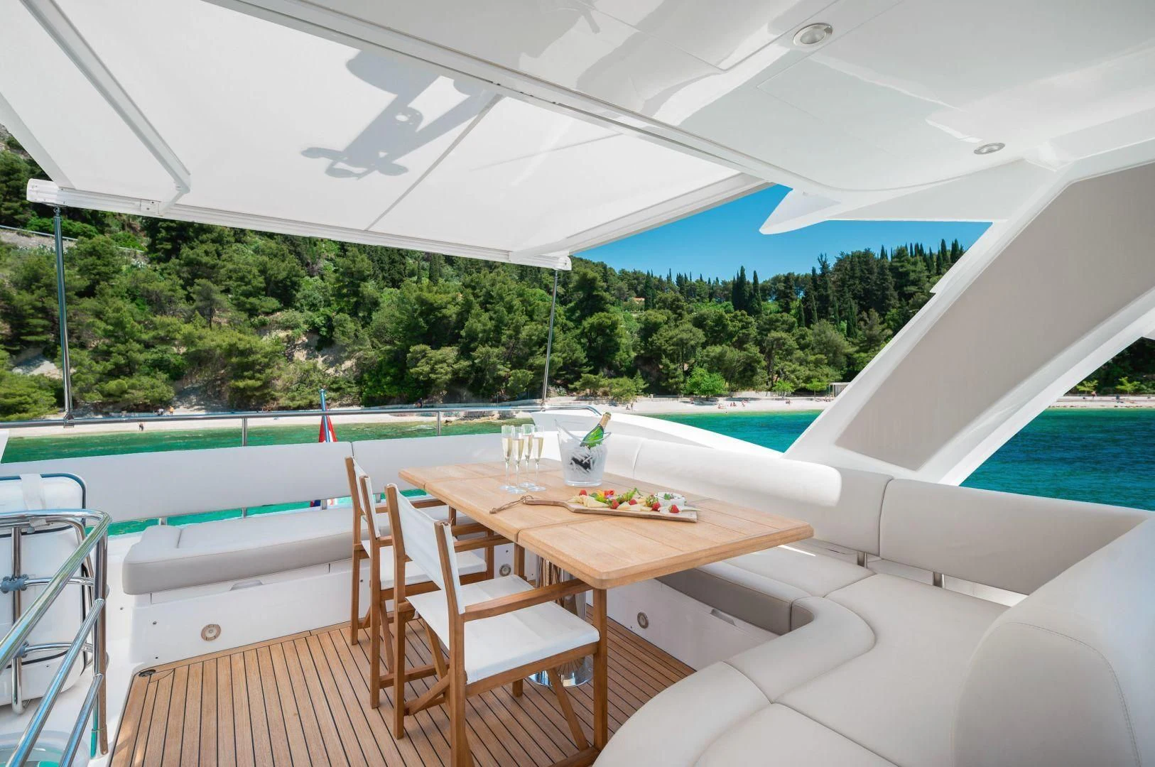 a table and chairs on a deck aboard HIDEAWAY Yacht for Charter