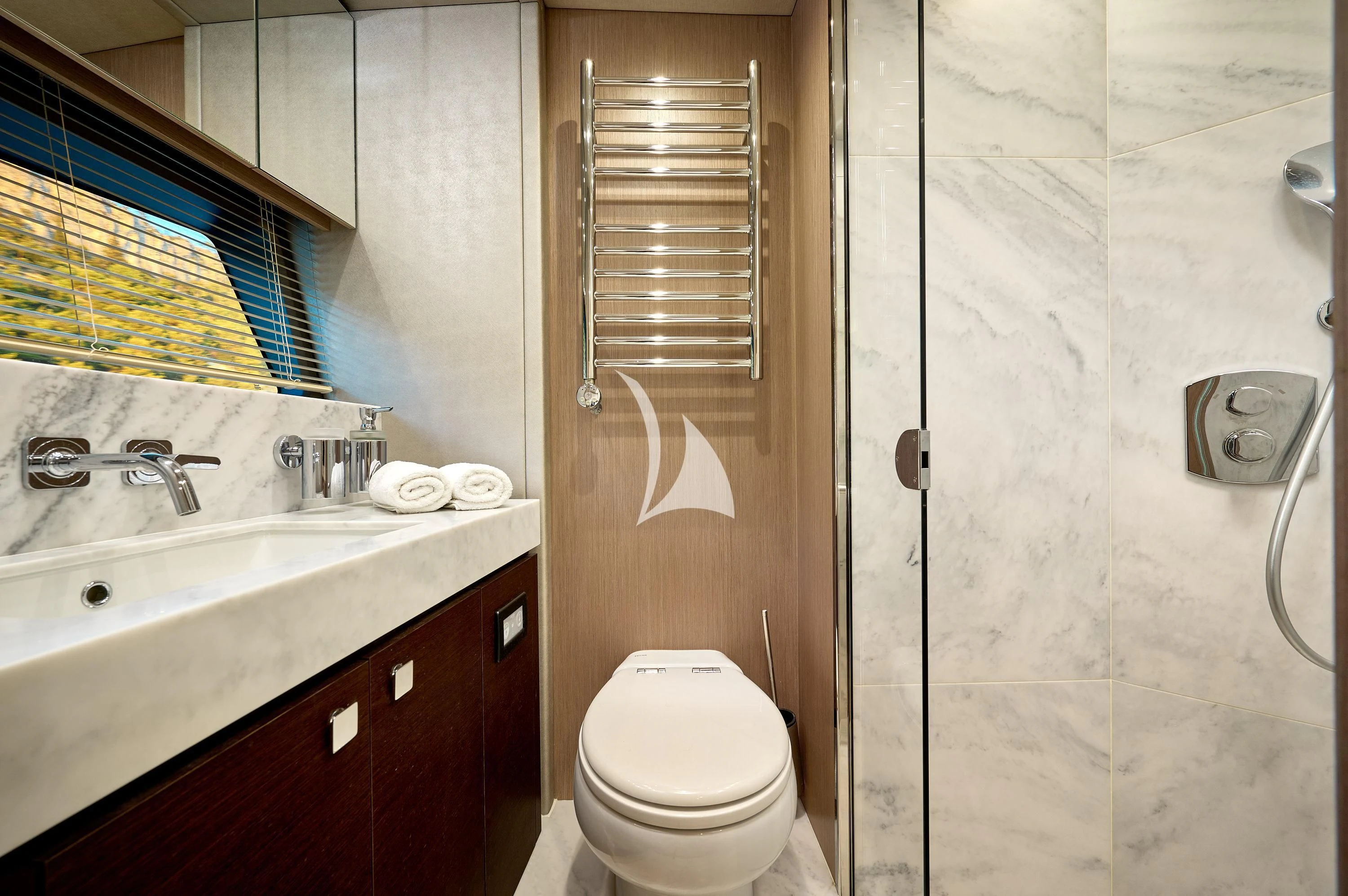 a bathroom with a toilet and sink aboard HIDEAWAY Yacht for Charter