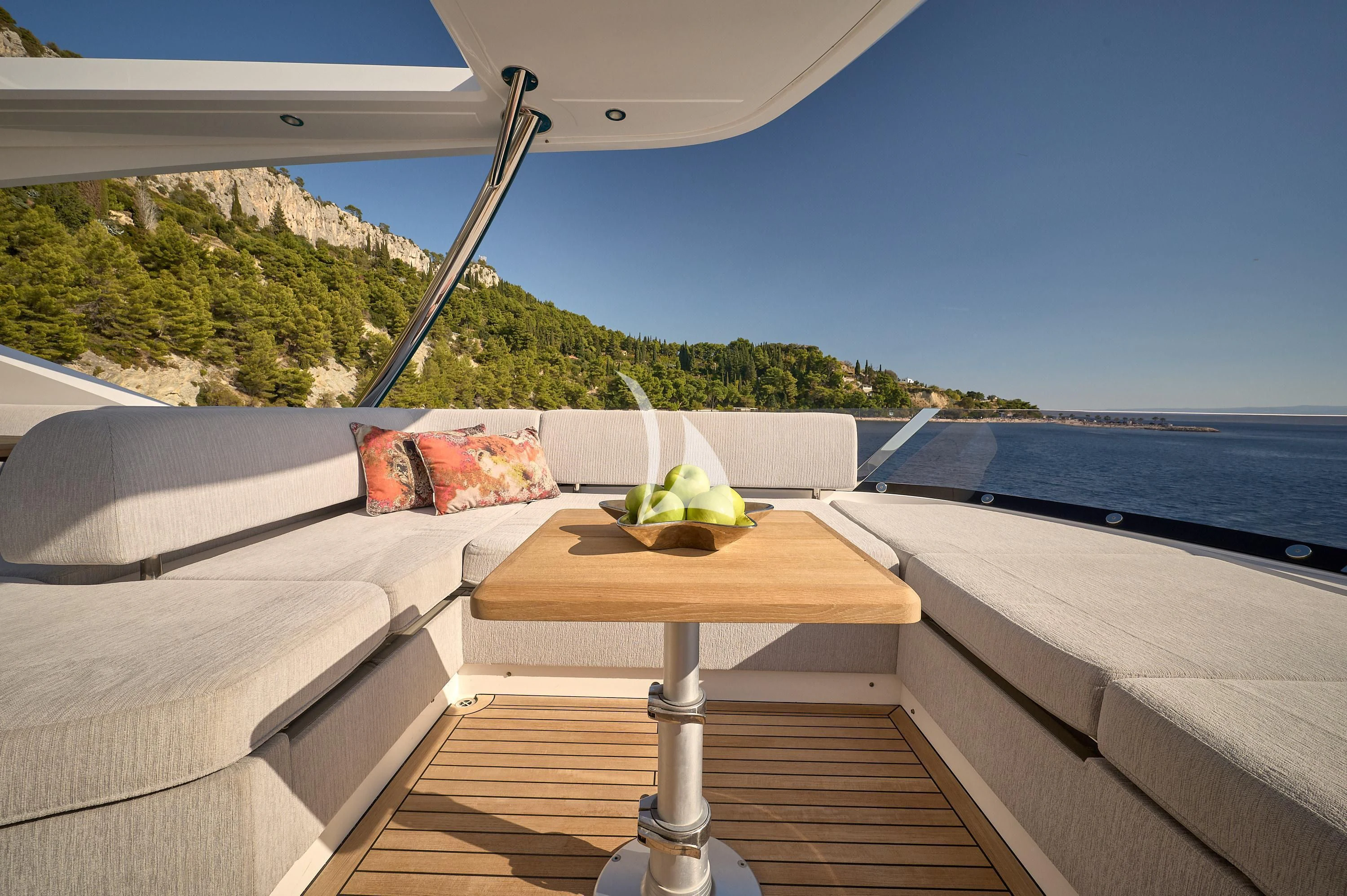 a bed with a table and a chair on it aboard HIDEAWAY Yacht for Charter