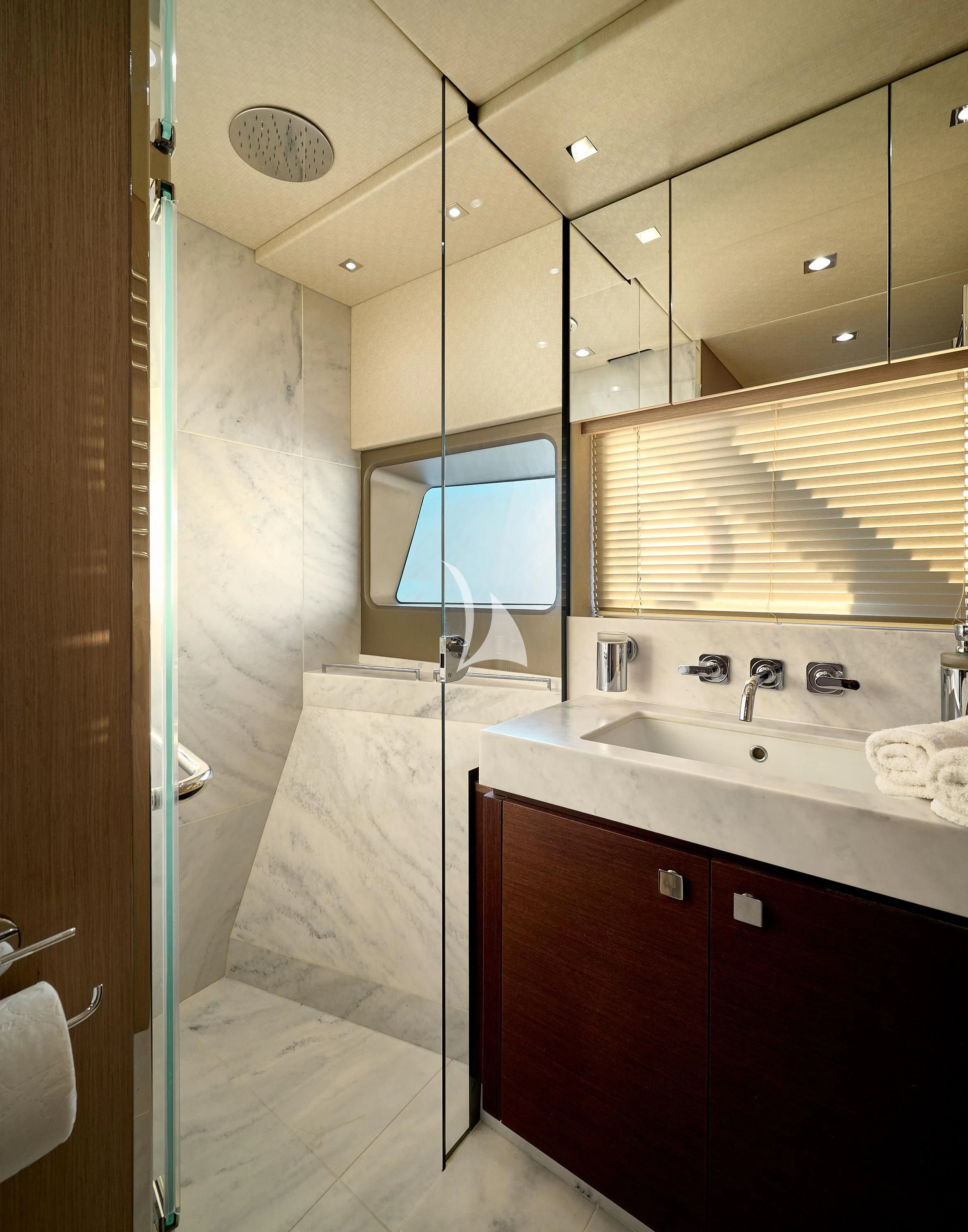 a bathroom with a sink and a mirror aboard HIDEAWAY Yacht for Charter