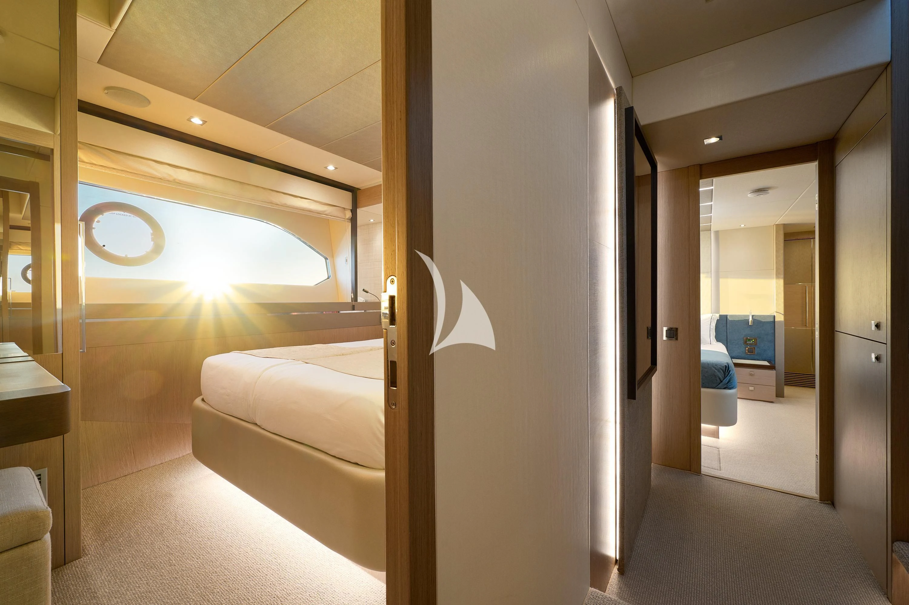 a room with a bed and a door aboard HIDEAWAY Yacht for Charter
