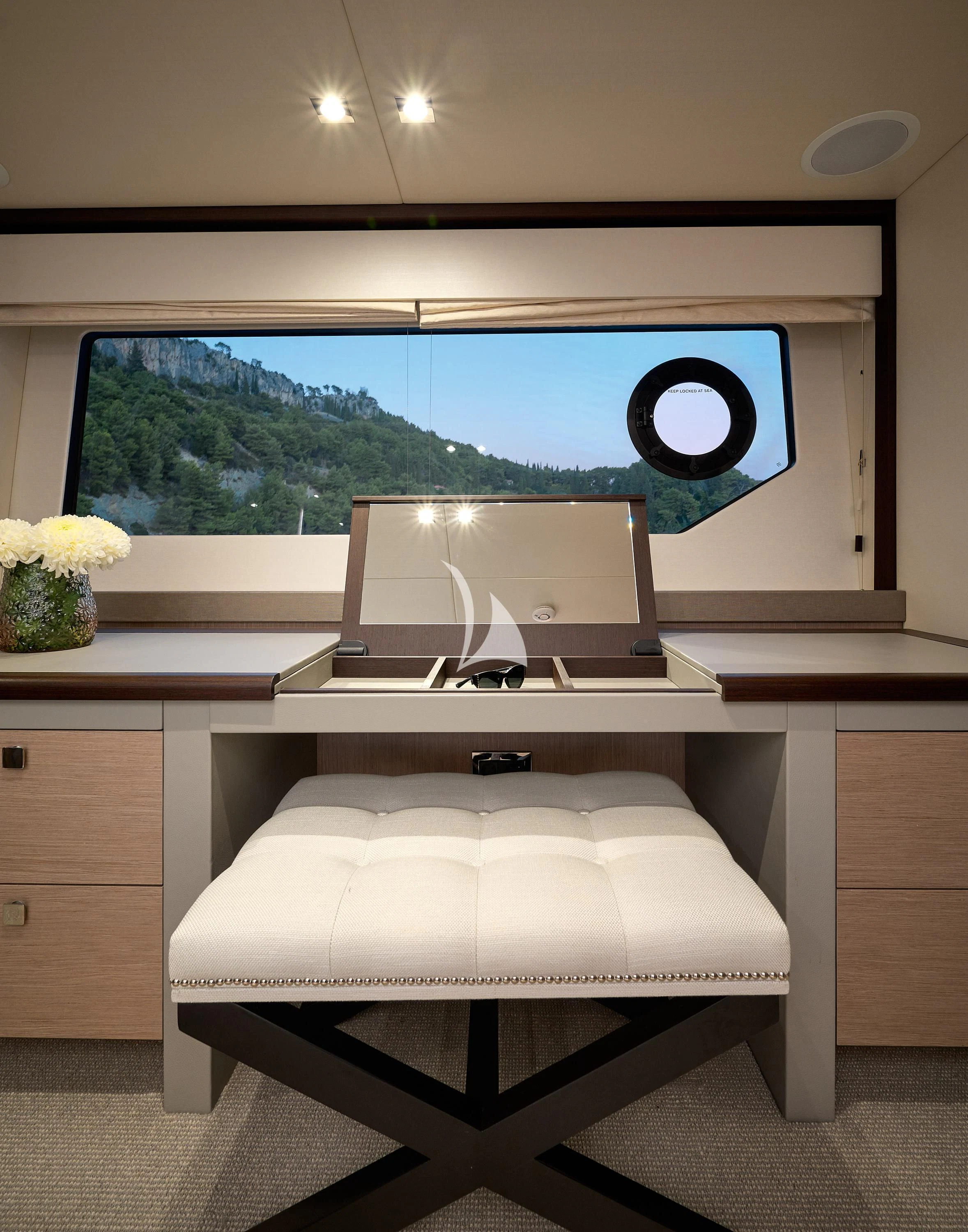 a white desk with a large window aboard HIDEAWAY Yacht for Charter