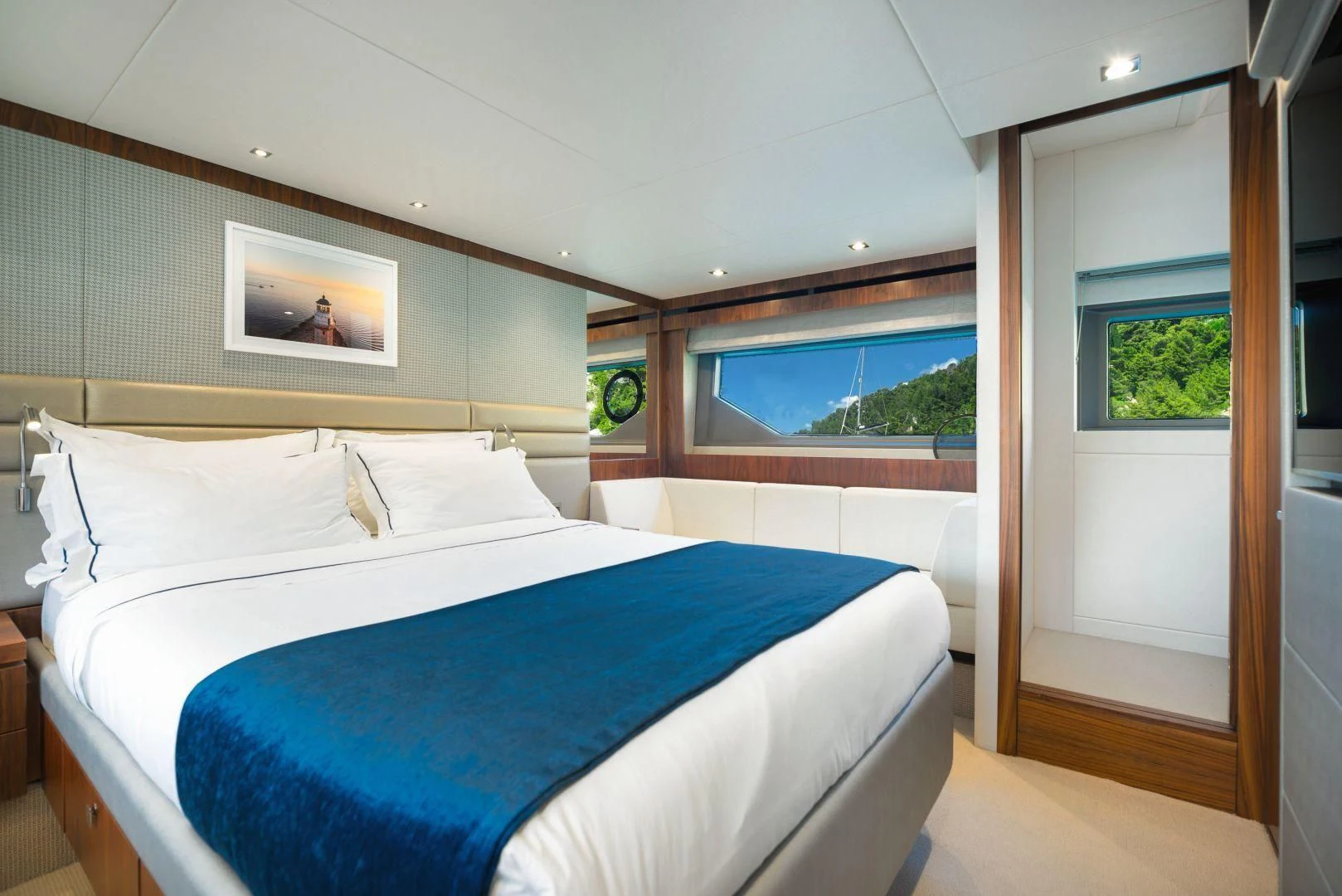 a bedroom with a large bed aboard HIDEAWAY Yacht for Charter