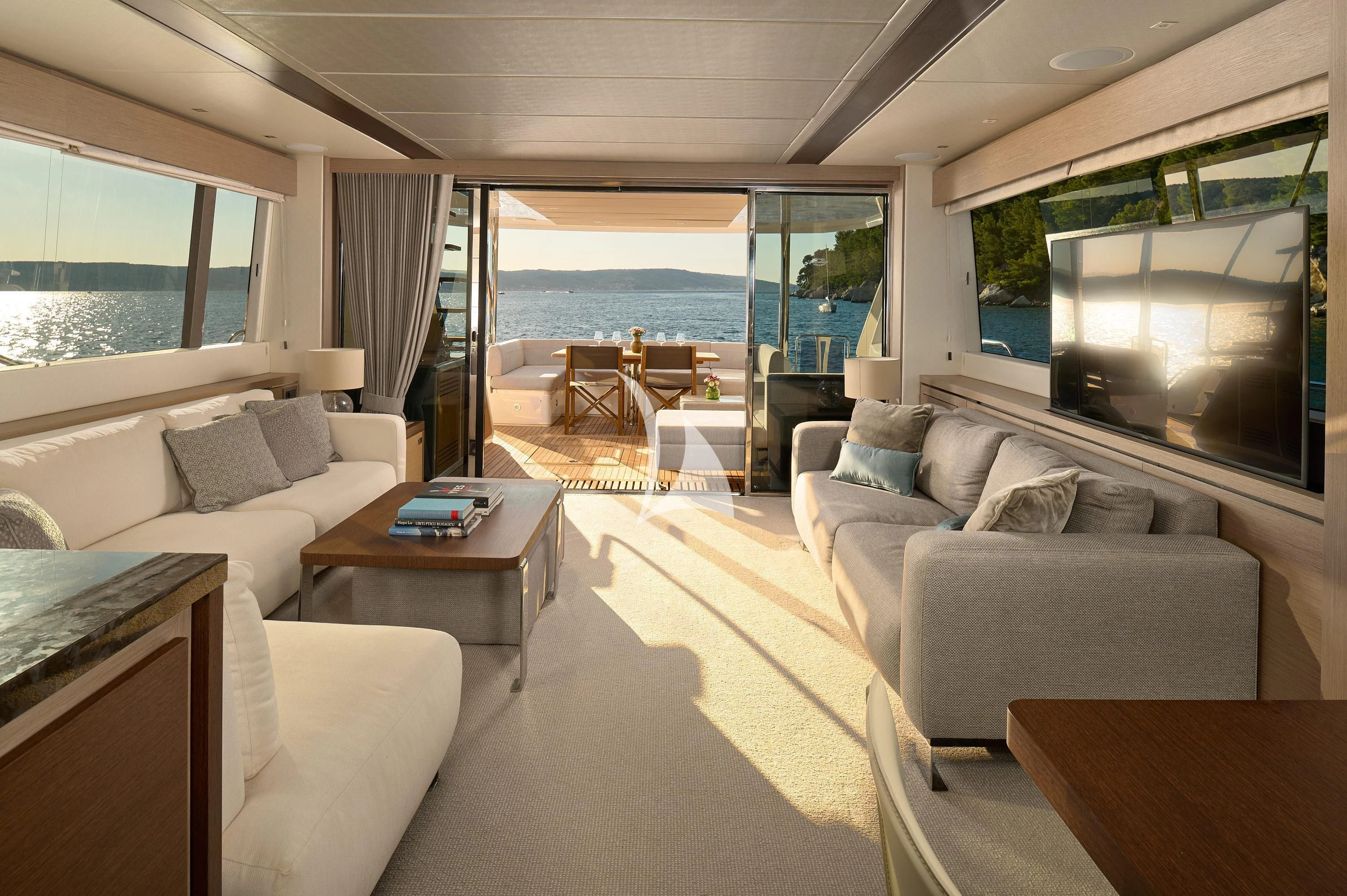 a living room with a large window aboard HIDEAWAY Yacht for Charter