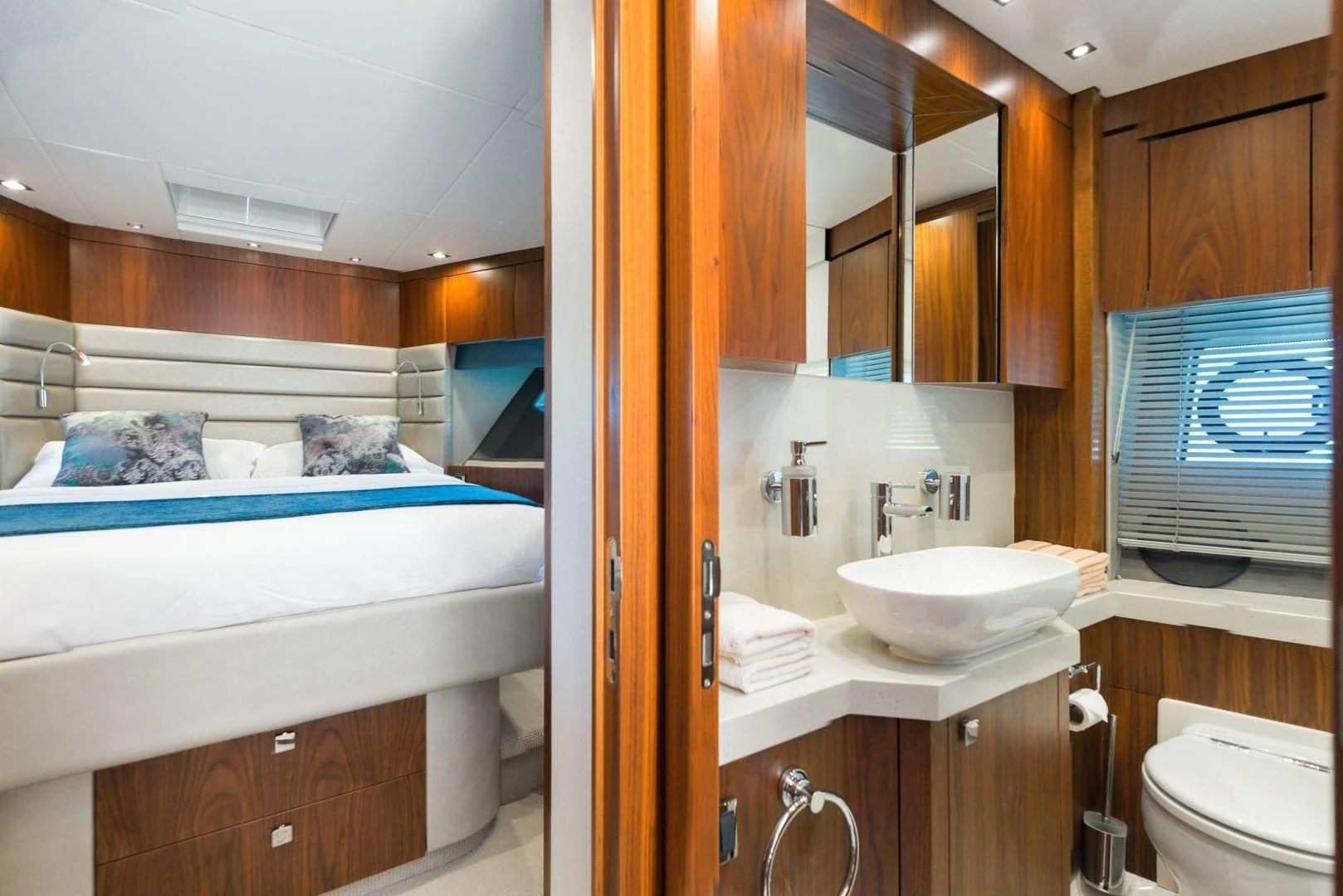 a bathroom with a sink and a bed aboard HIDEAWAY Yacht for Charter