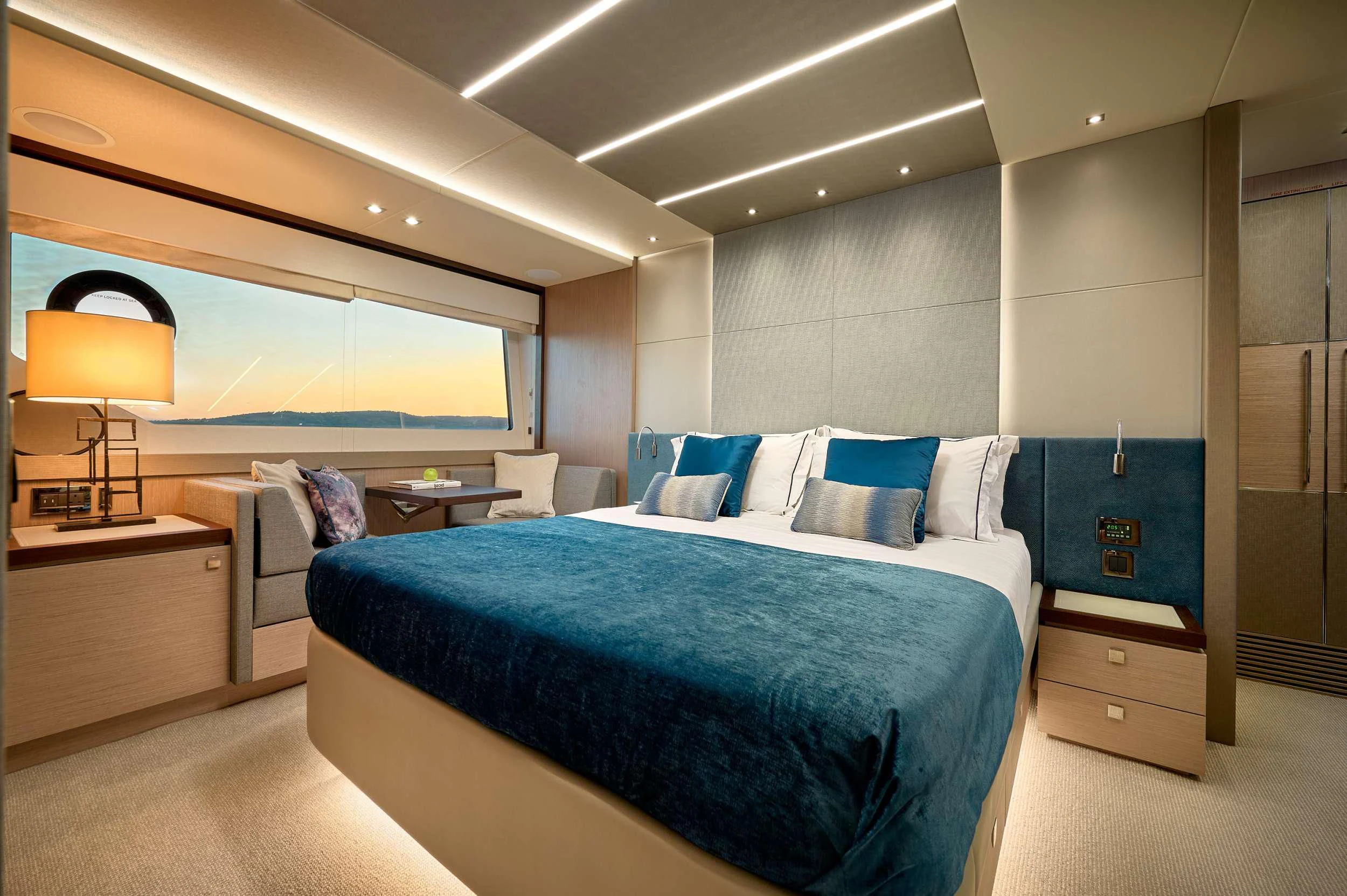 a bedroom with a bed and a desk aboard HIDEAWAY Yacht for Charter